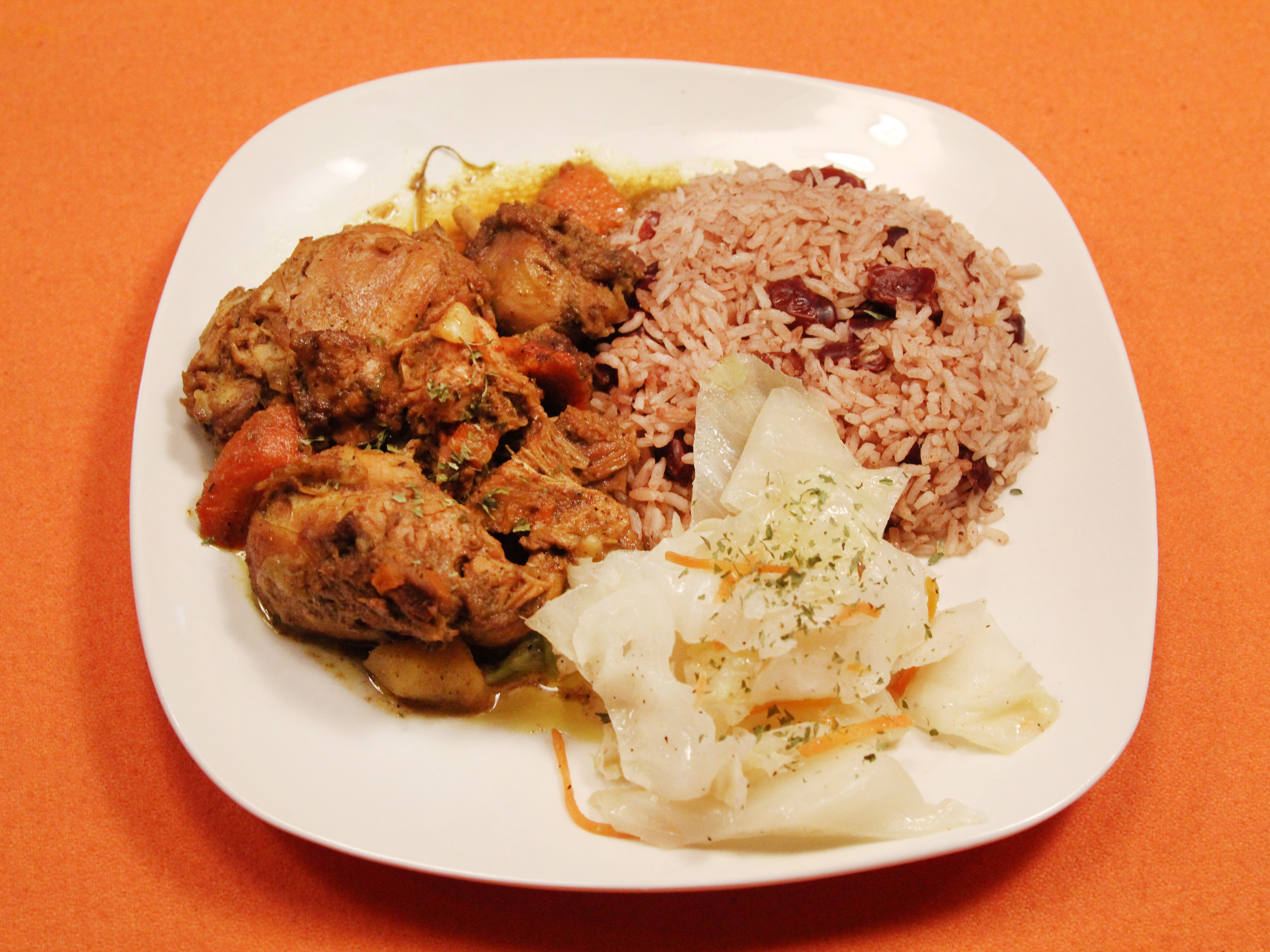 Order Curry Chicken food online from Caribbean Vybz Bar & Grille store, Cleveland on bringmethat.com