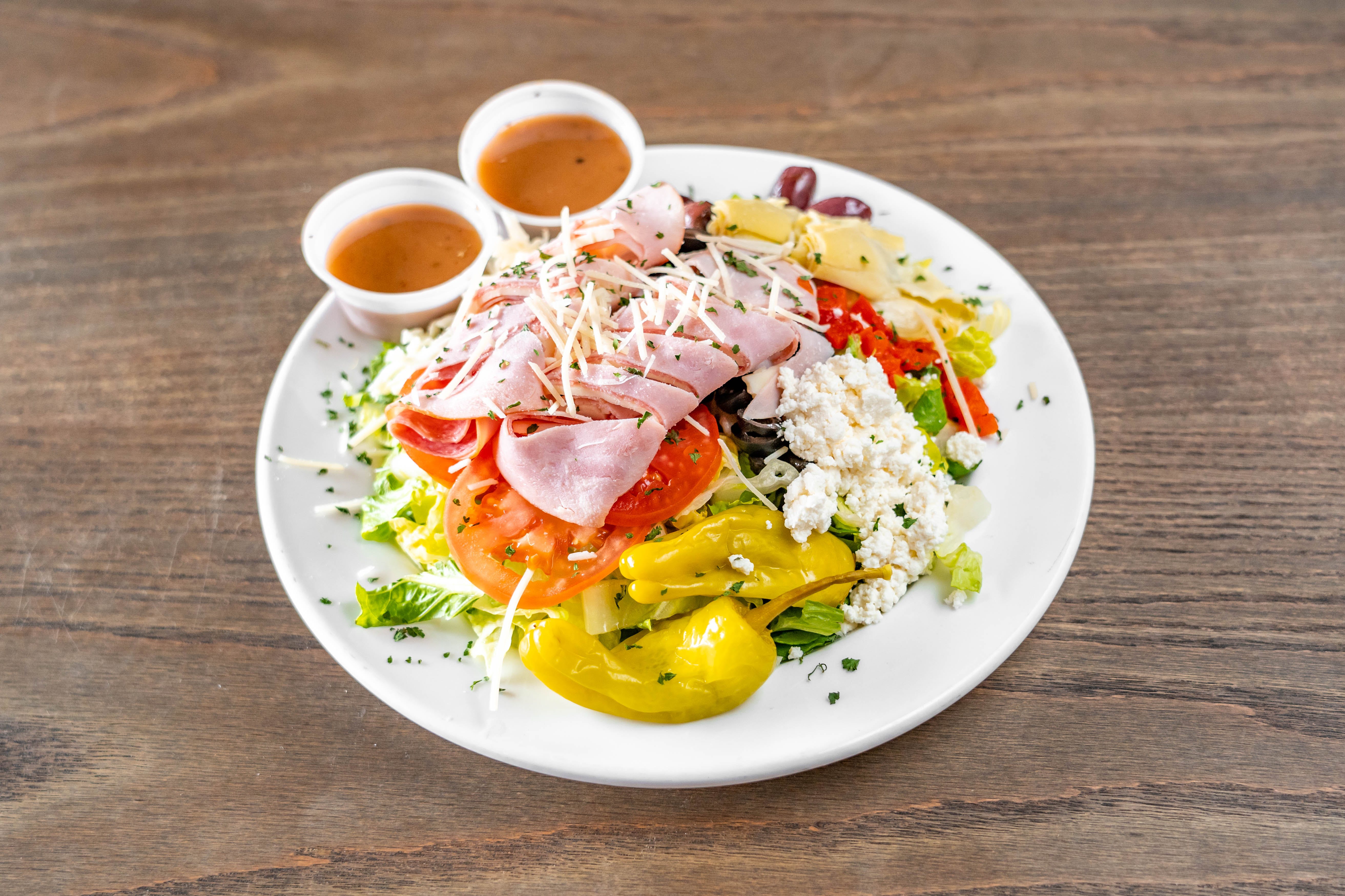 Order Antipasto Salad - Full food online from Goomba Pizza store, San Antonio on bringmethat.com