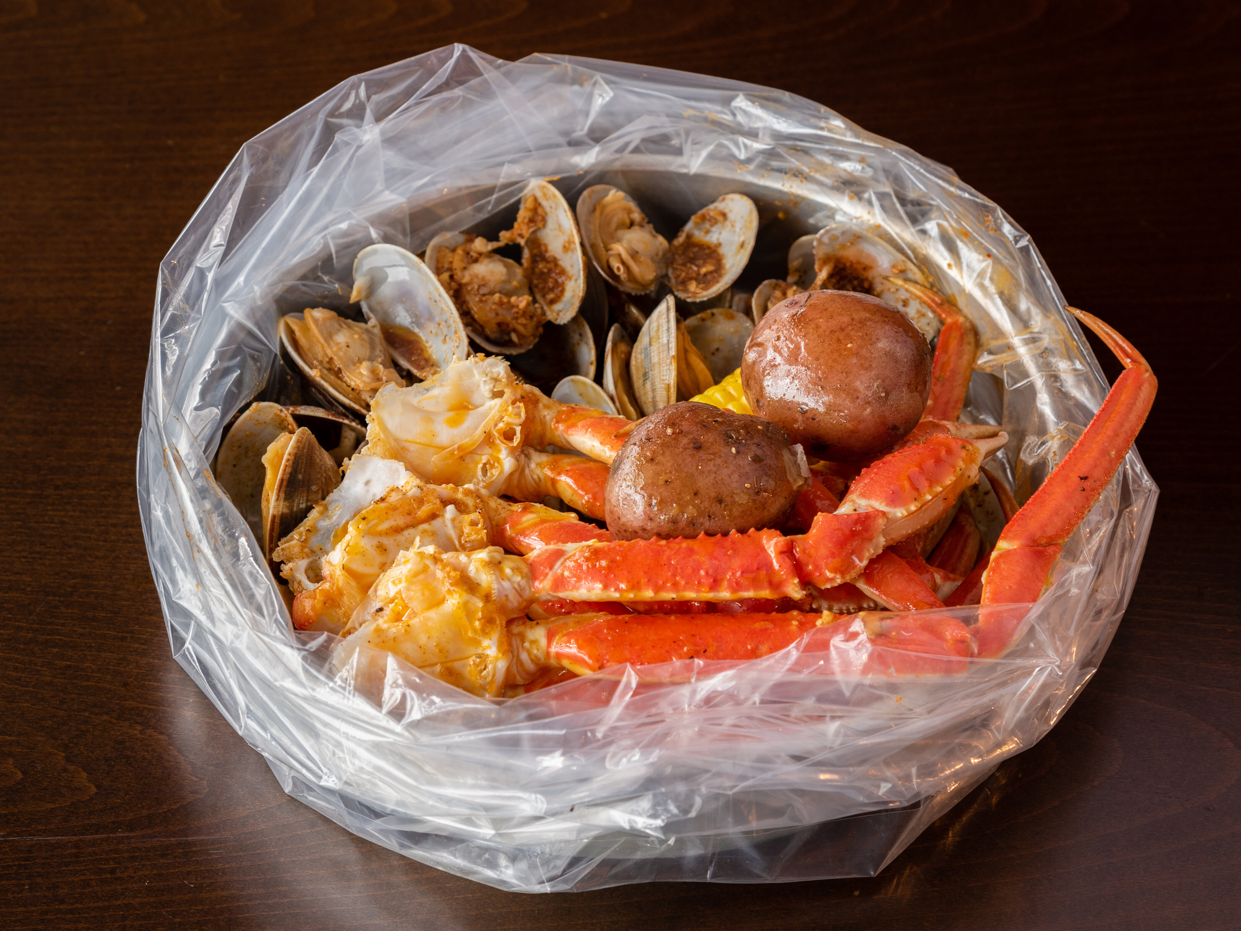 Order 2. Snow Crab Leg and Baby Clam Combo food online from Shaking Seafood store, Roslindale on bringmethat.com