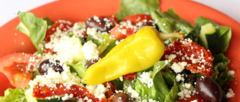Order Greek Salad food online from Palio's Pizza store, Coppell on bringmethat.com