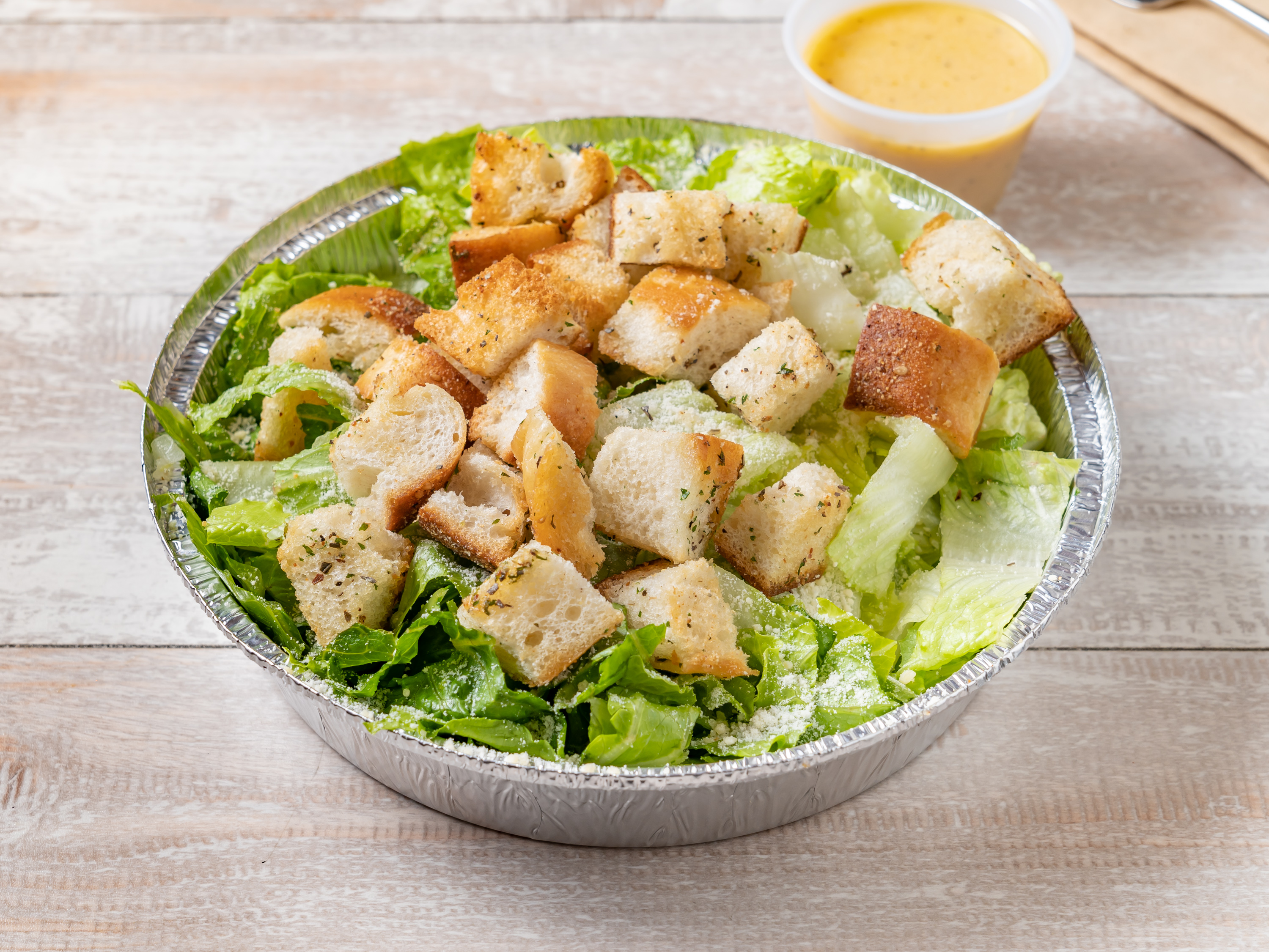 Order Caesar Salad food online from Cousins Pizzeria store, Bronx on bringmethat.com
