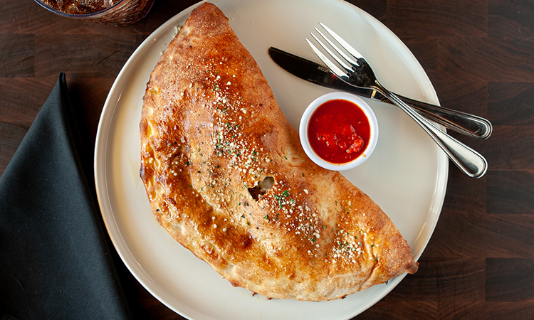 Order Create Your Own Calzone food online from Rocco's Pizzeria store, Austin on bringmethat.com