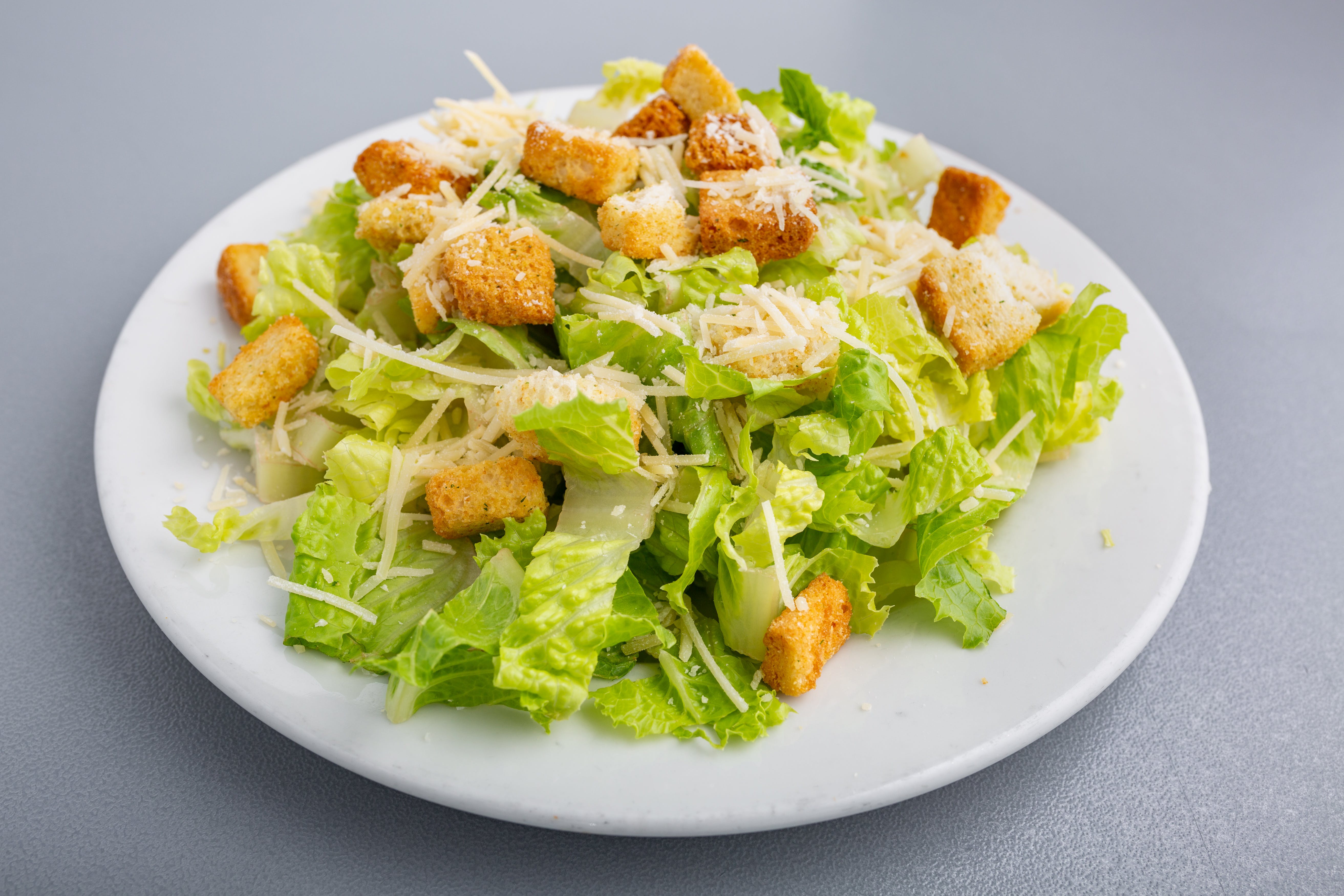 Order Caesar Salad - Salad food online from Napoli Pizza store, Henderson on bringmethat.com