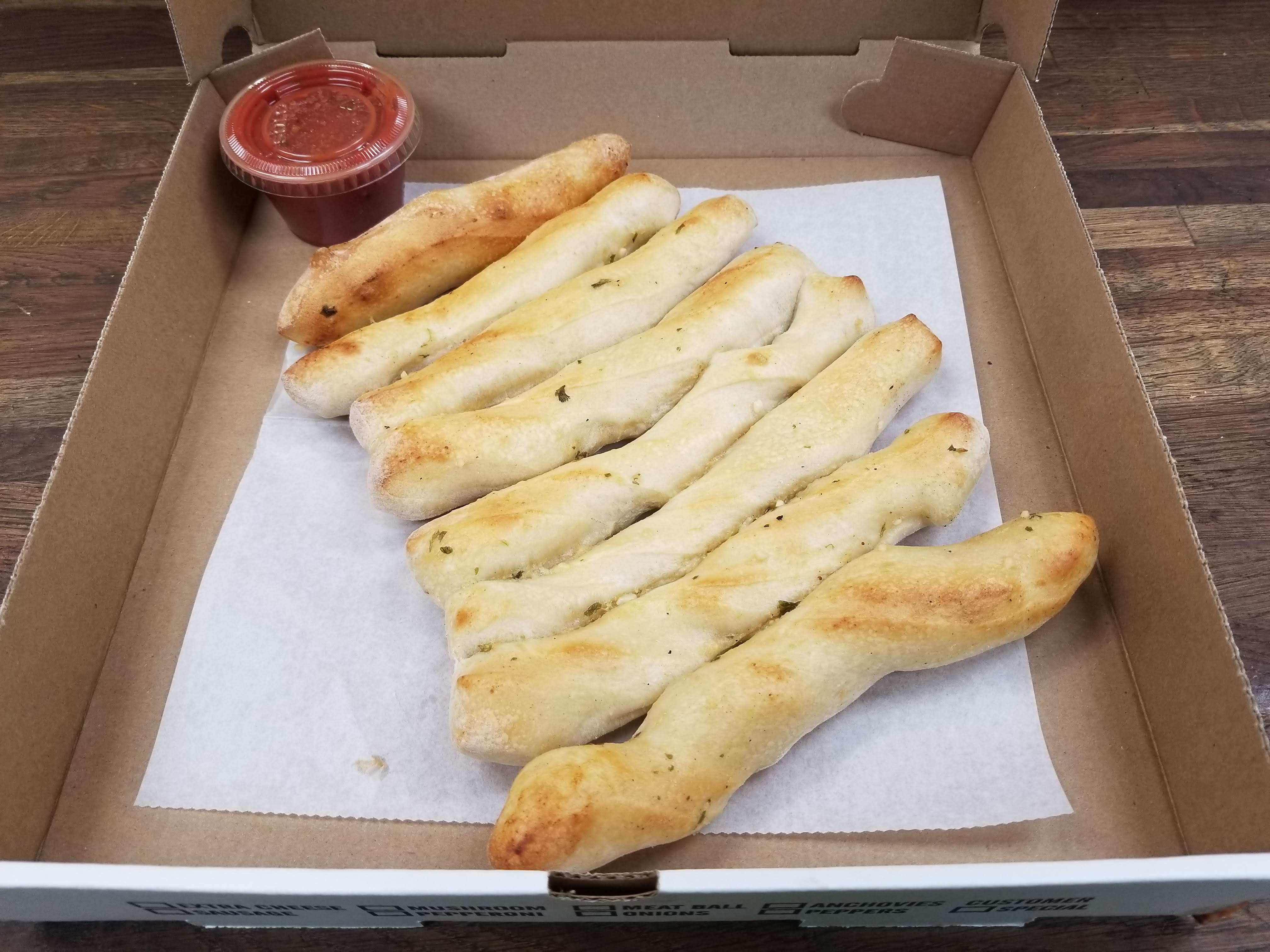 Order 8 Breadsticks with Sauce food online from Pizza Italia store, Pittsburgh on bringmethat.com