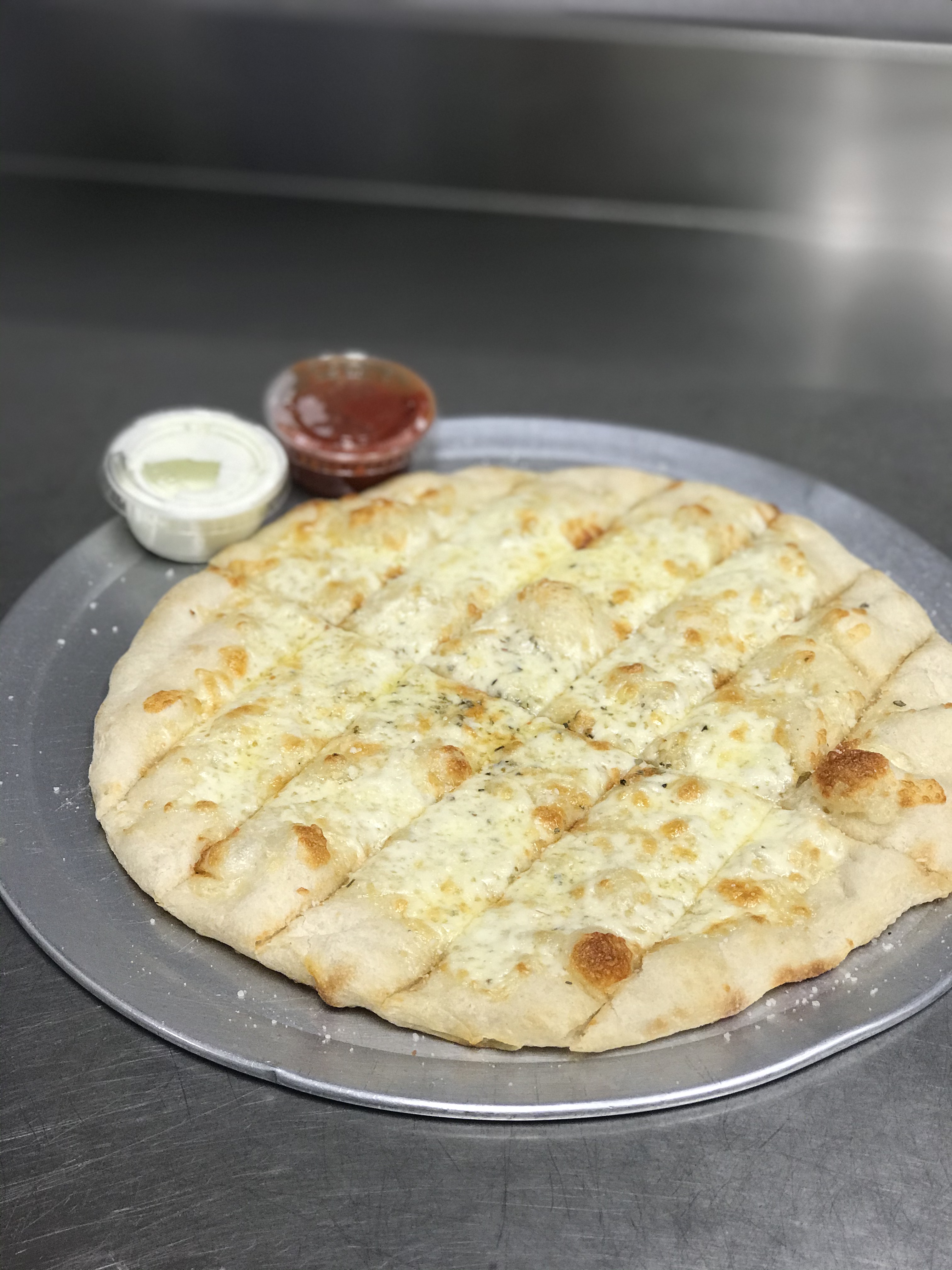 Order Cheesy Breadsticks food online from Johnny's Pizza store, Cary on bringmethat.com