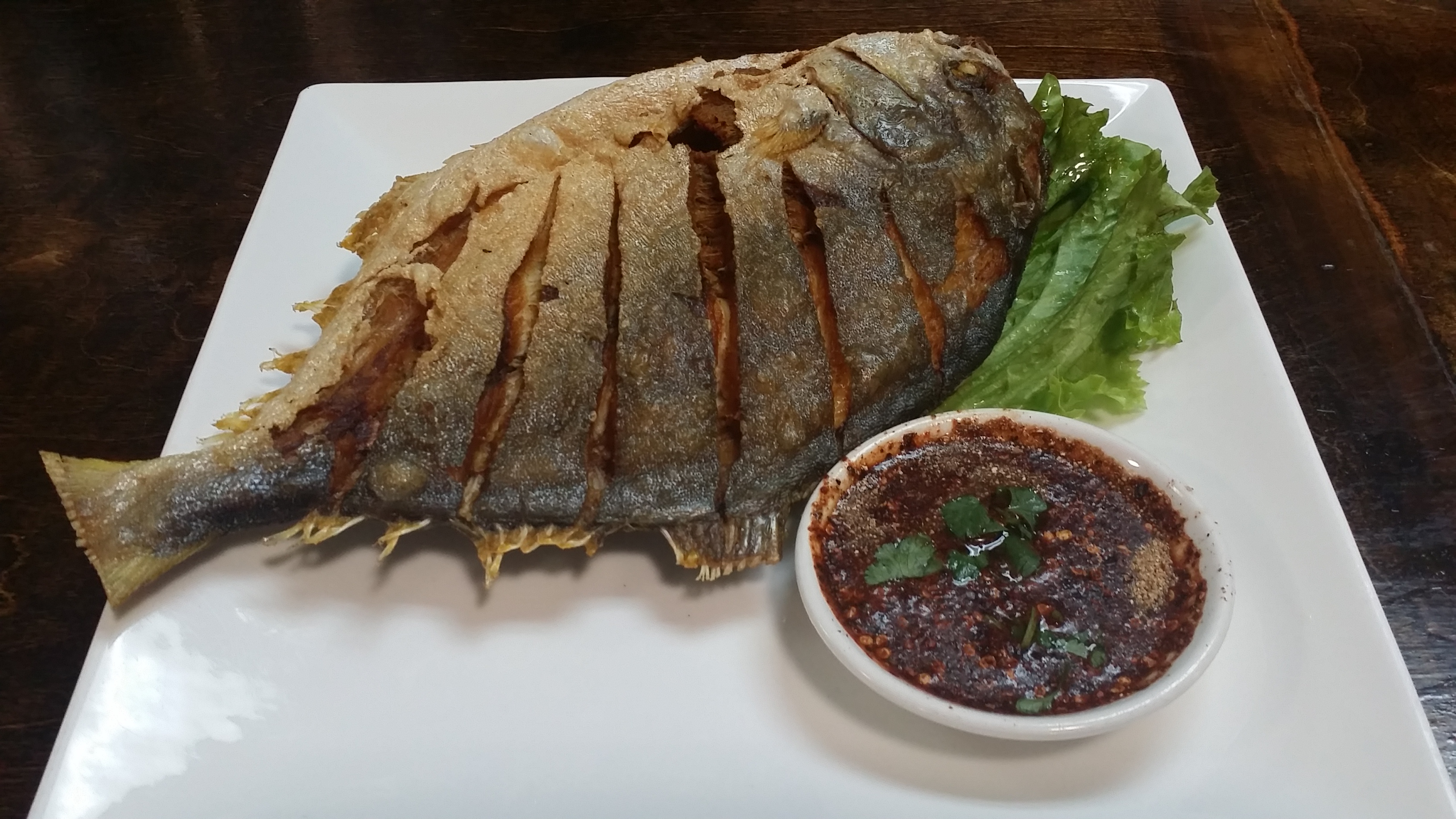 Order Crispy Pompano food online from Thai Lily Cafe store, Houston on bringmethat.com