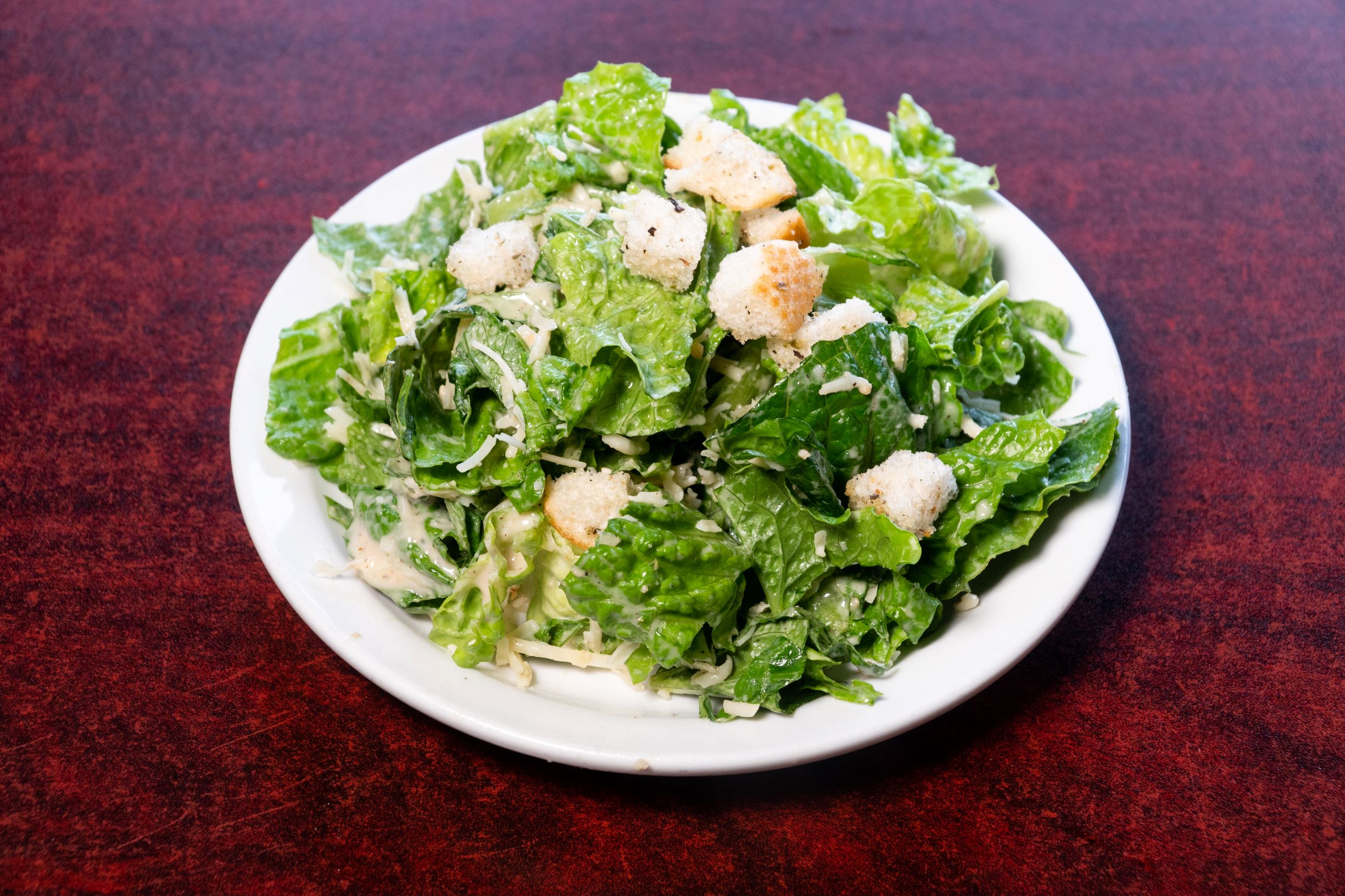 Order Caesar Salad food online from Falcone Pizzeria store, Oklahoma City on bringmethat.com