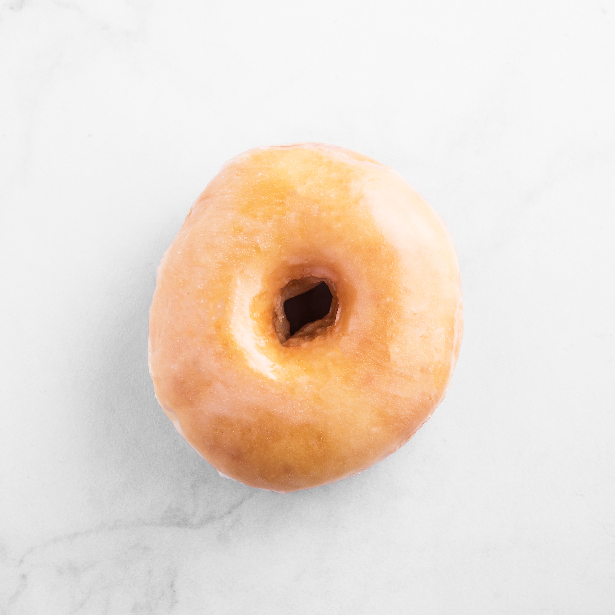 Order Round Glazed donut food online from Prime Donuts store, Conroe on bringmethat.com
