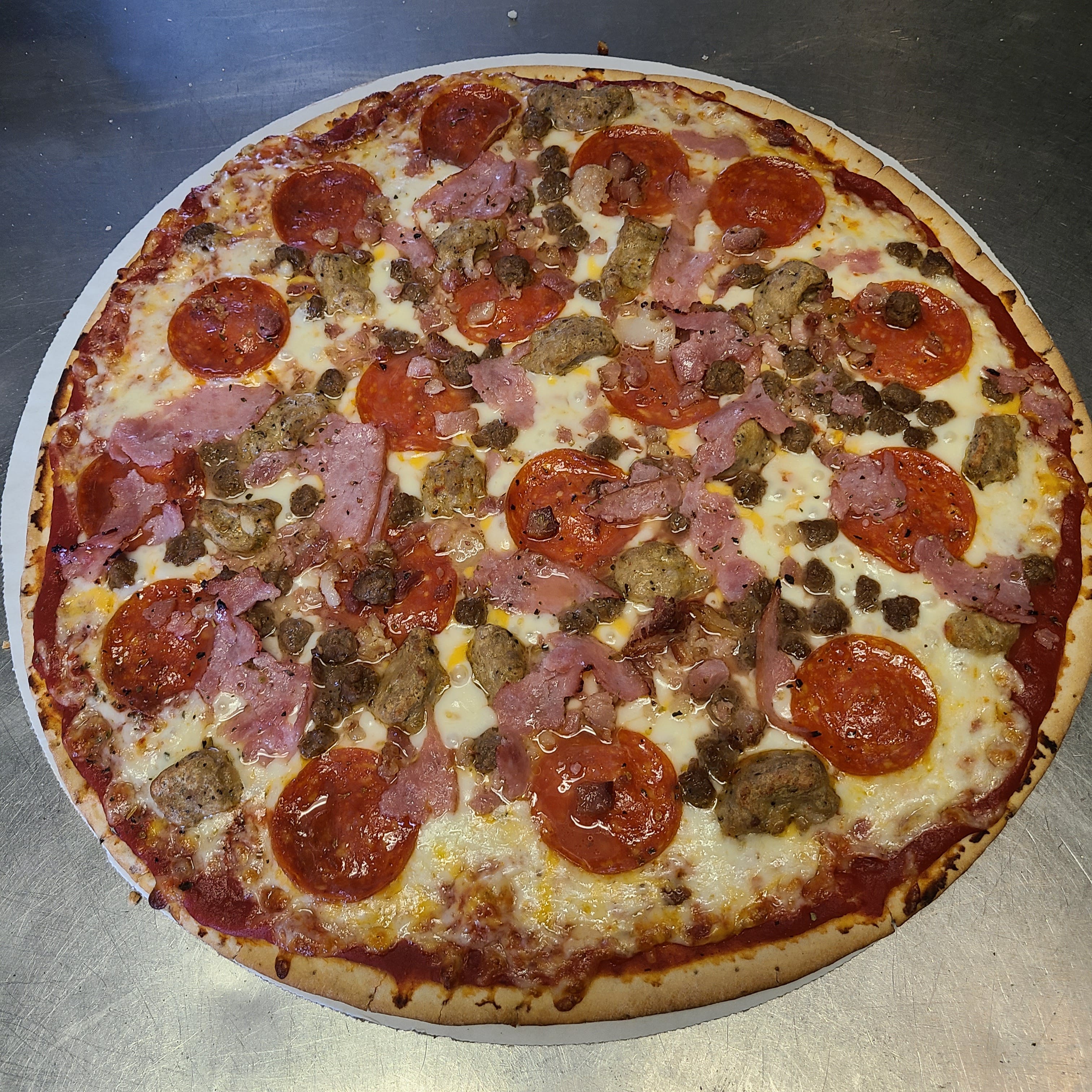 Order Meat Lover's Pizza - 10'' (Serves 1-2) food online from Timber Creek Pizza Co store, Lake Mills on bringmethat.com