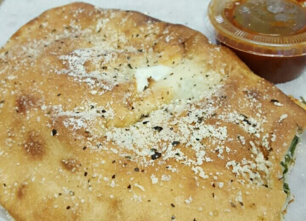 Order Calzone food online from Demo Pizzeria & Deli store, Raleigh on bringmethat.com