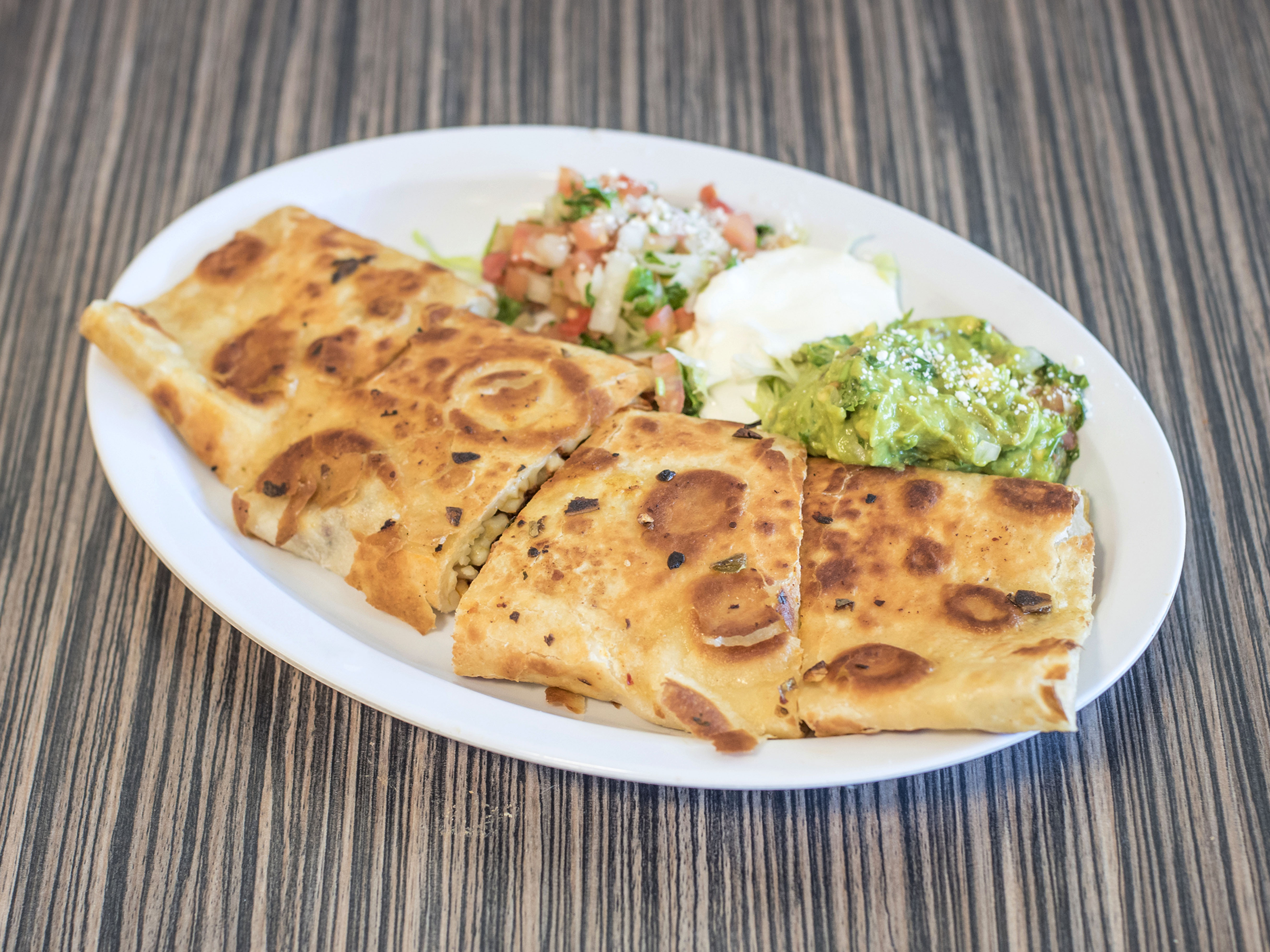 Order Quesadilla Suiza food online from Dulce Antojitos store, Pittsburg on bringmethat.com