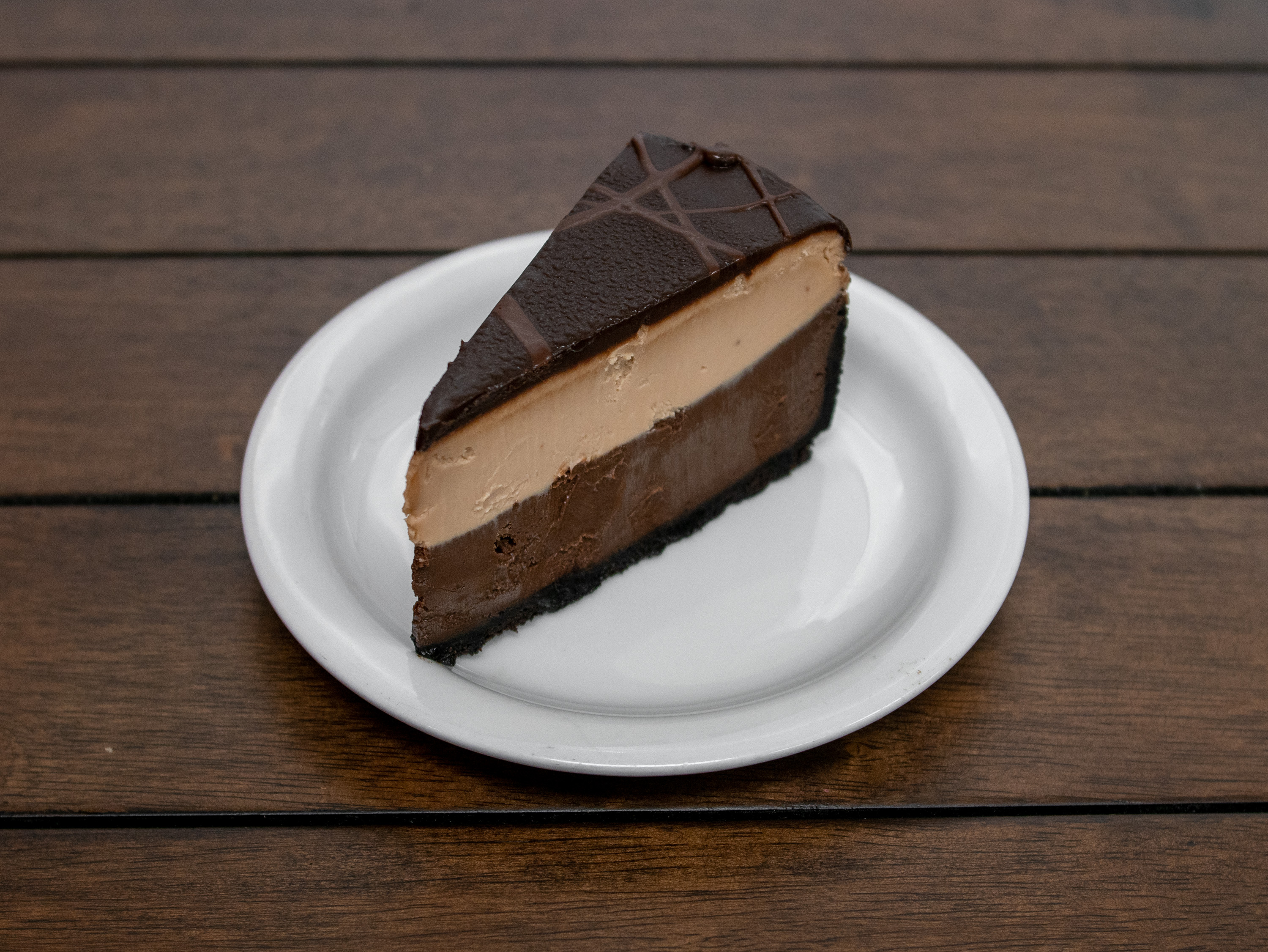 Order Triple Chocolate Cheesecake food online from Flight Deck Restaurant store, Lexington on bringmethat.com
