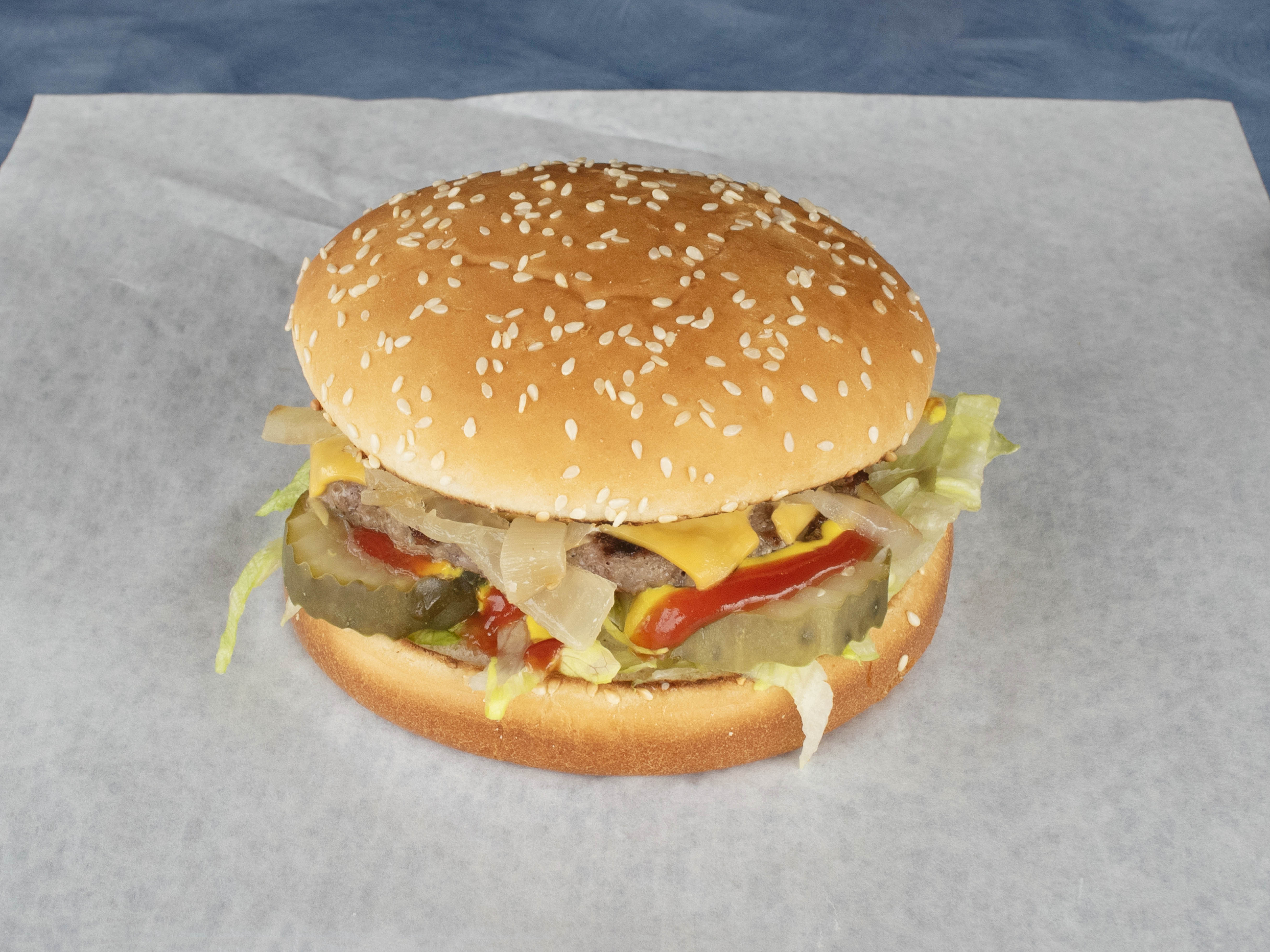 Order 1/4 lb. Cheeseburger food online from Pluto's Beef & Hot Dogs store, Oak Lawn on bringmethat.com