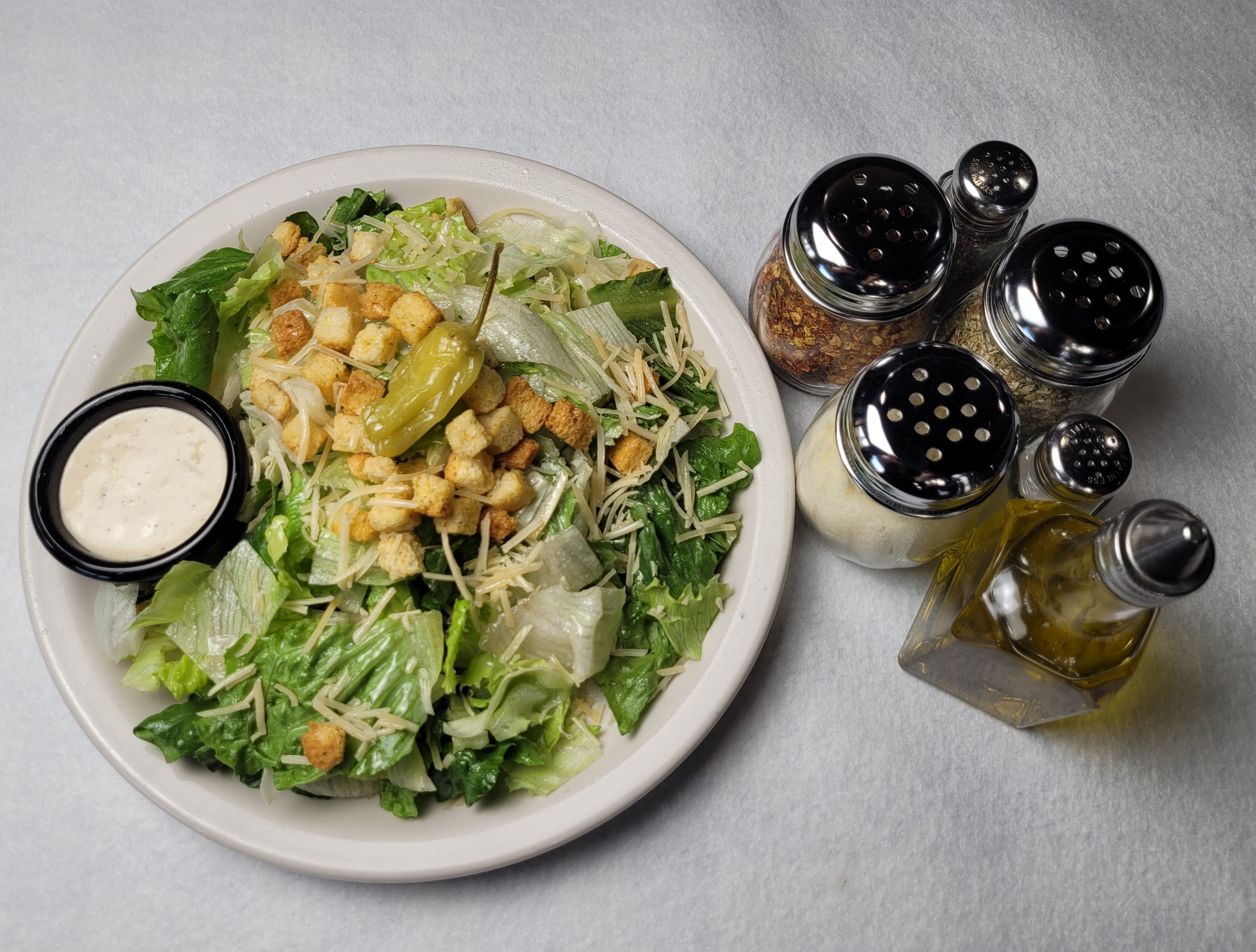 Order Caesar Salad - Medium food online from Mony Pizzeria store, Houston on bringmethat.com