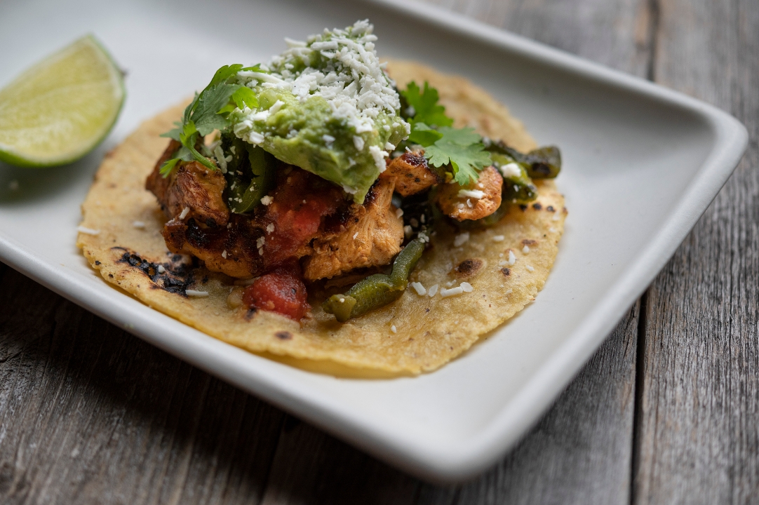 Order 1 Taco Ancho Chicken food online from Cactus Restaurant store, Seattle on bringmethat.com