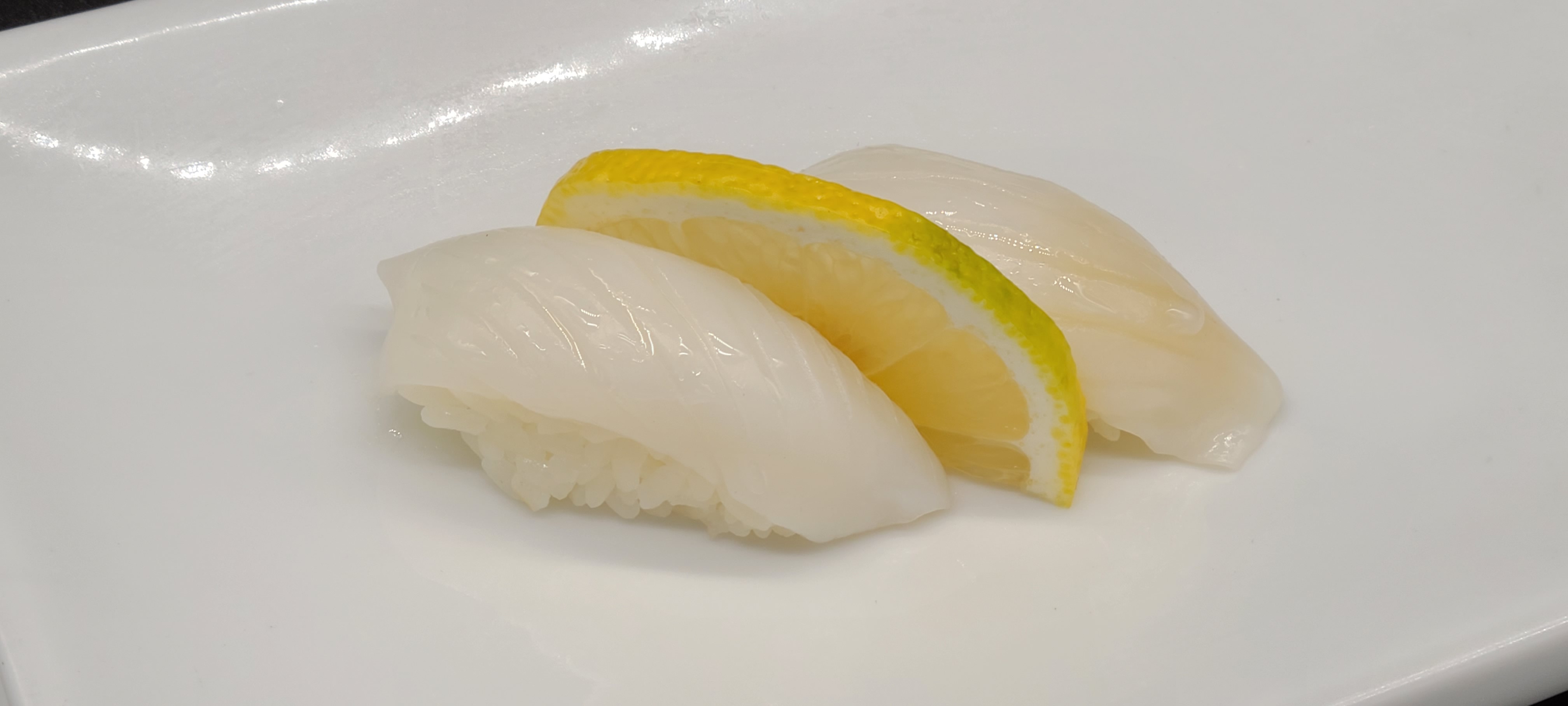 Order N17. Squid Sushi(2pcs) food online from Hello Sushi store, Fullerton on bringmethat.com