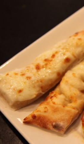 Order Cheesy Bread food online from La Famiglia Wood Fired Pizzeria store, Humble on bringmethat.com