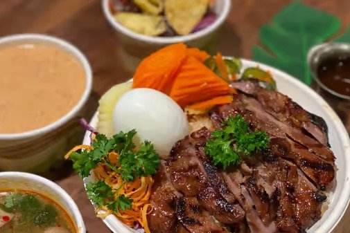 Order Marinated grilled pork steak food online from Thai Taste Express store, Silver Spring on bringmethat.com