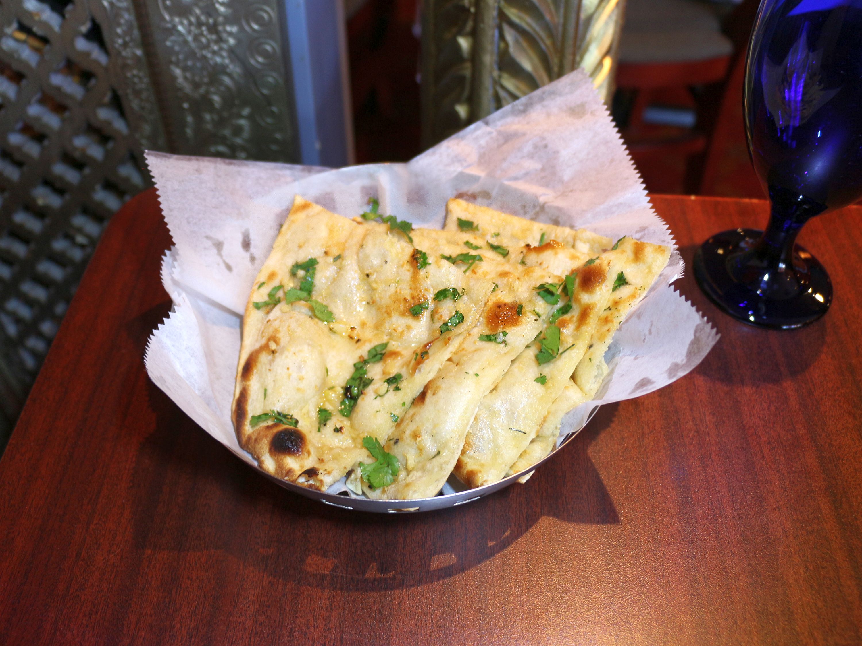 Order Garlic Naan food online from Sizzling bombay store, Bel Air on bringmethat.com
