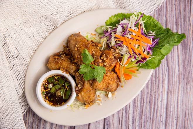 Order Garlic Chicken Wings (7 pcs.) food online from King Of Thai Noodle store, San Francisco on bringmethat.com