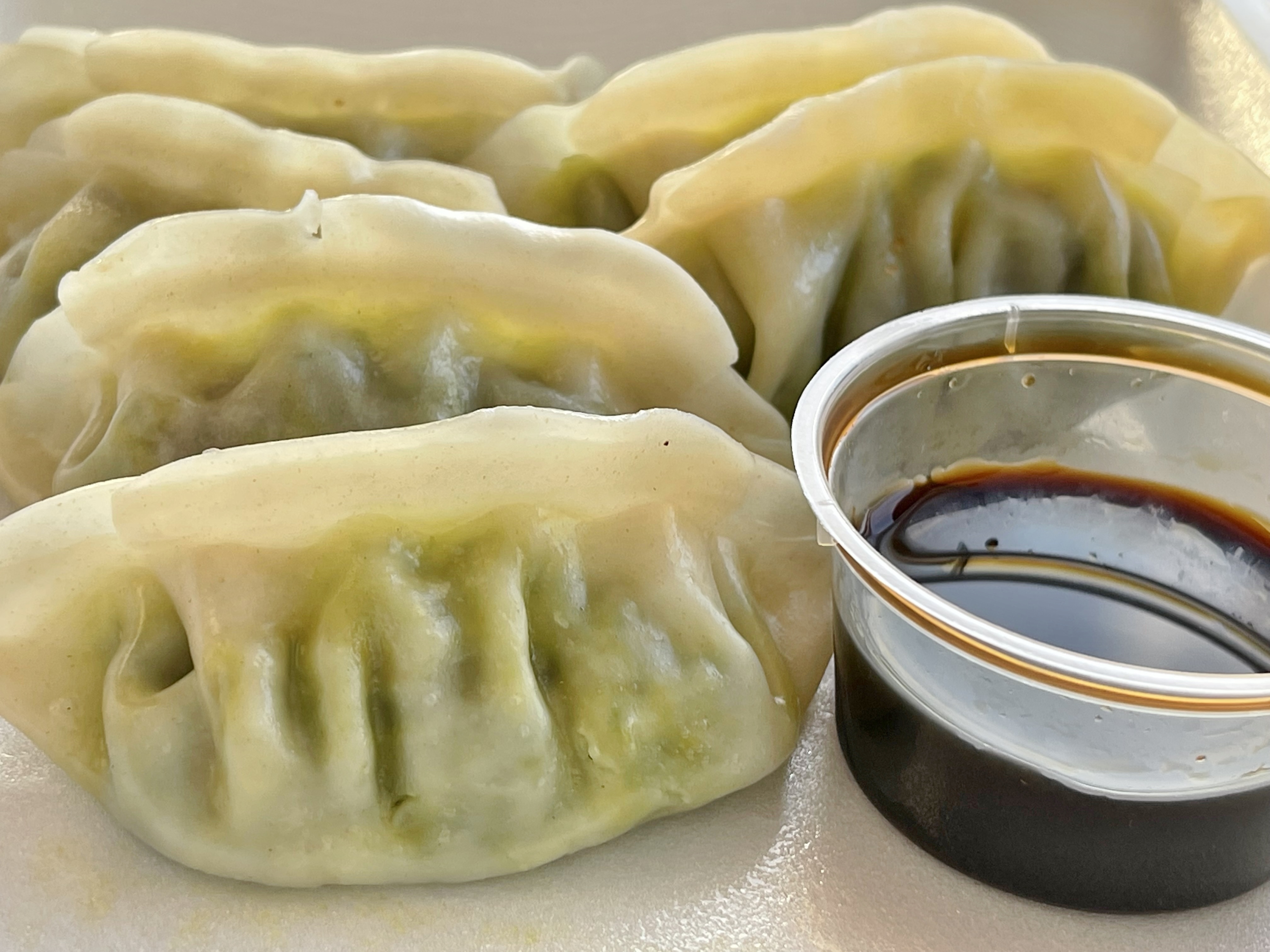 Order 7. Steamed Vegetable Dumplings (6) food online from Chef Ming's Kitchen store, Beverly Hills on bringmethat.com