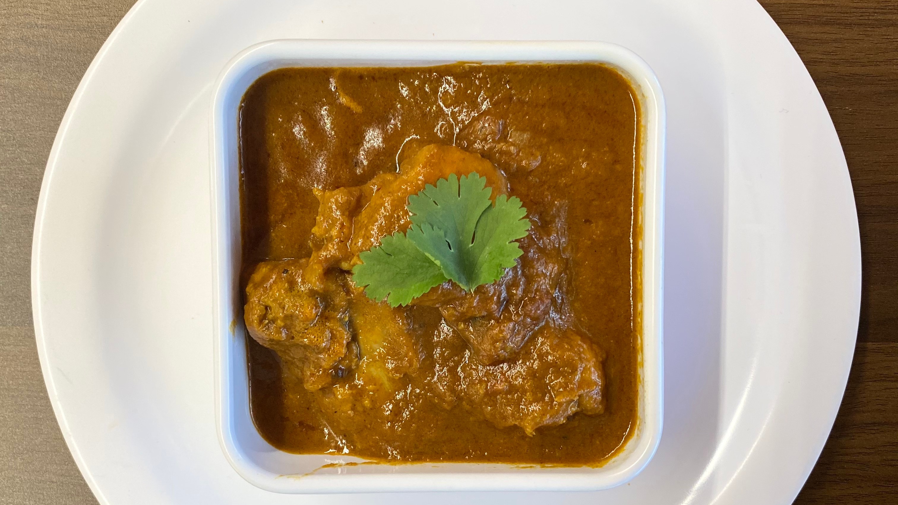 Order Chicken Curry food online from Indian Cafe store, East Moline on bringmethat.com