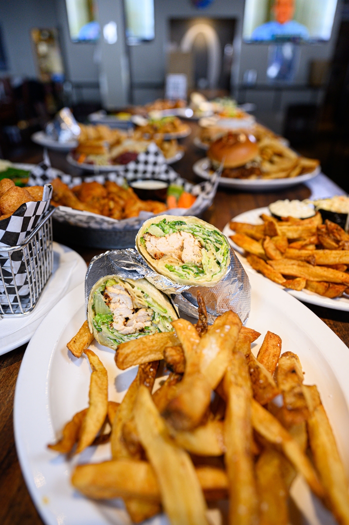 Order Chicken Caesar Wrap food online from Quincy's South Bar & Grille store, Rockville on bringmethat.com