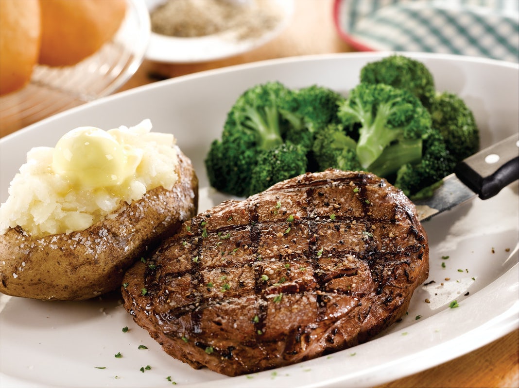 Order 10-oz. Ribeye Steak* food online from Ocharley store, Erie on bringmethat.com