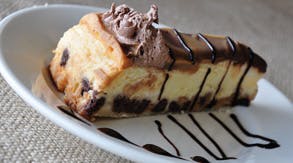 Order Snickers Bar Cake - Dessert food online from Bella Napoli Pizza & Restaurant store, Milford on bringmethat.com
