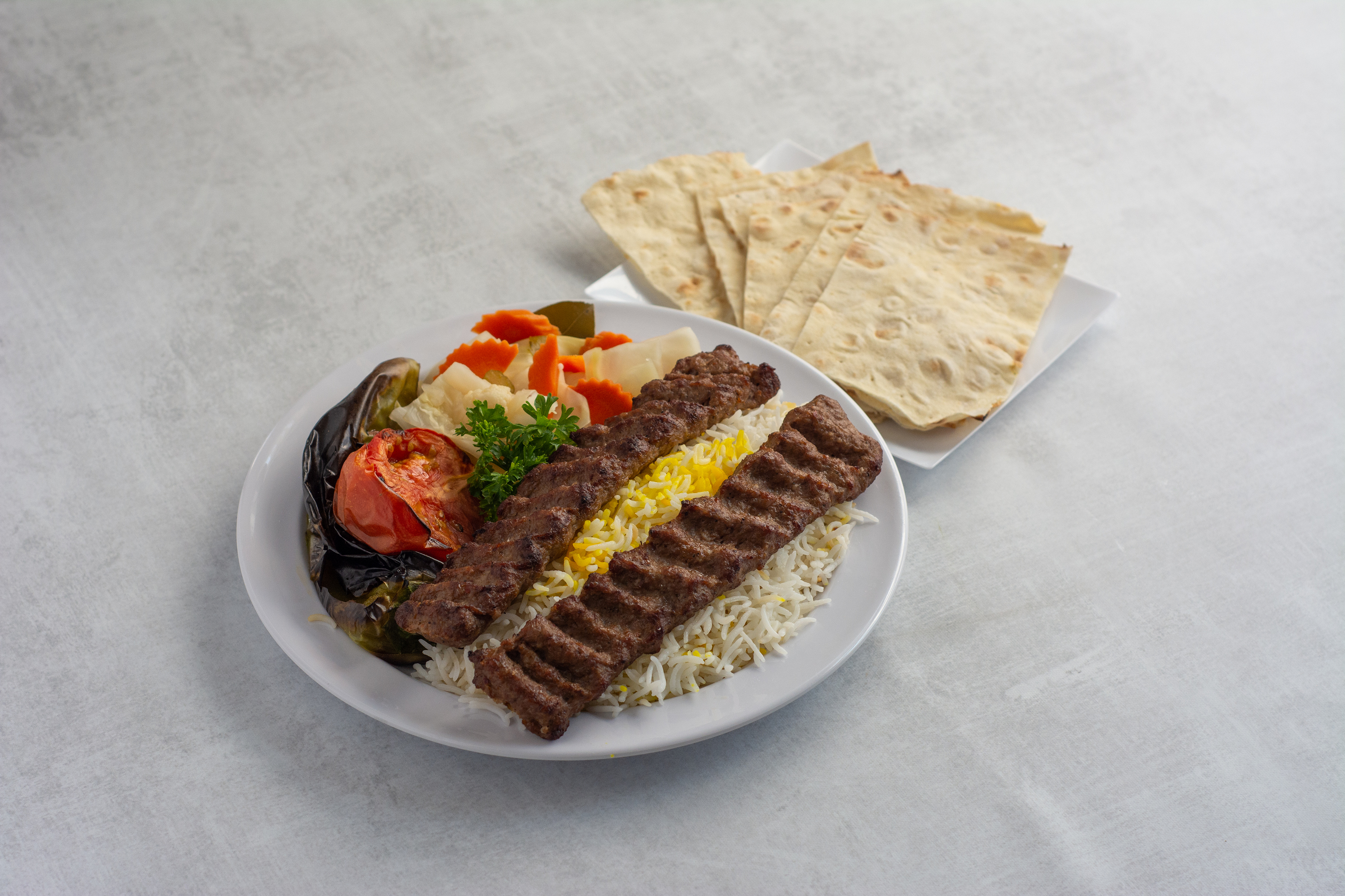 Order 2. Luleh Kebab Dinner Plate food online from Caravan restaurant store, Glendale on bringmethat.com