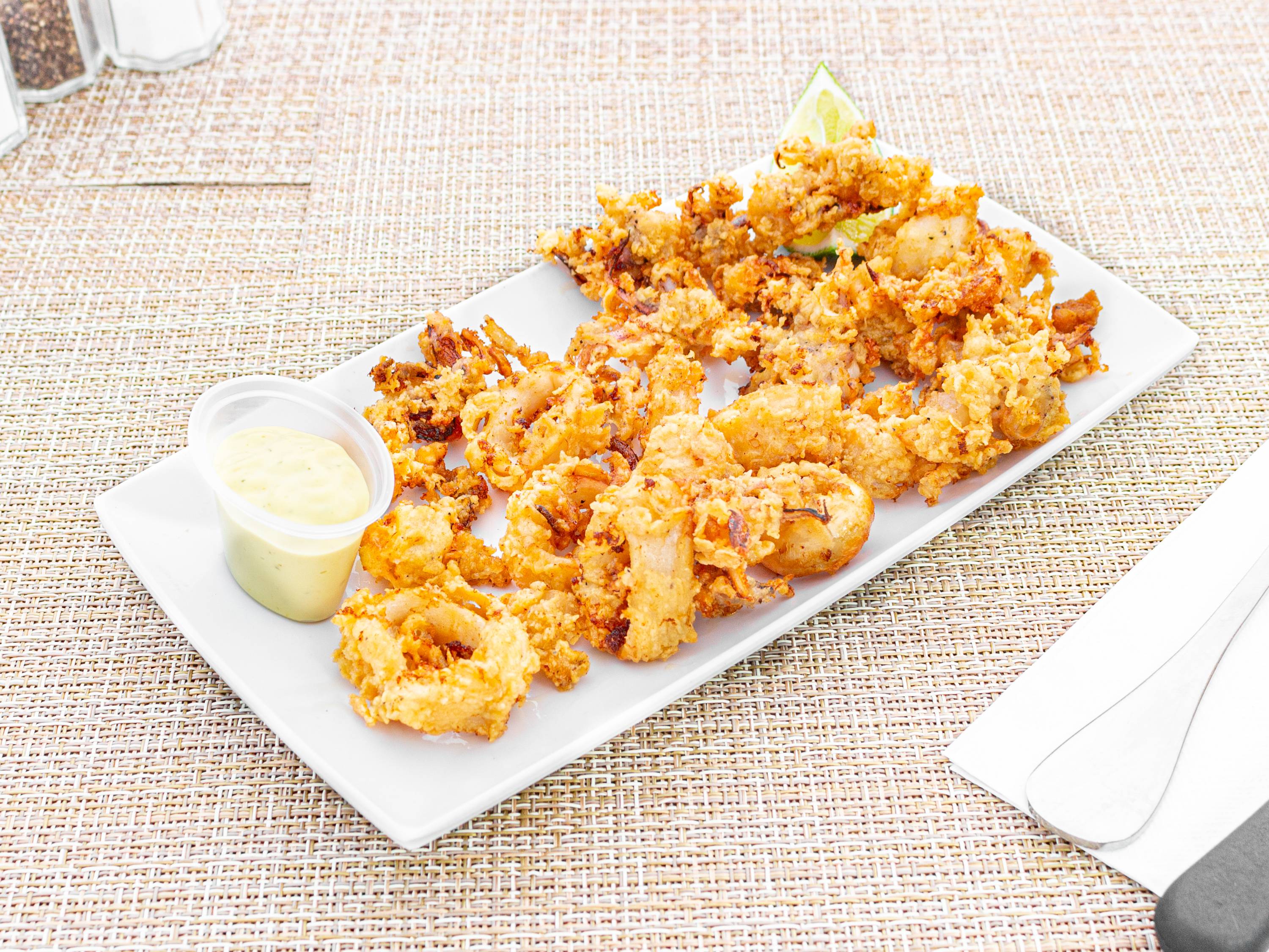 Order 4. Fried Calamary food online from Freddy's Deli store, North Bergen on bringmethat.com