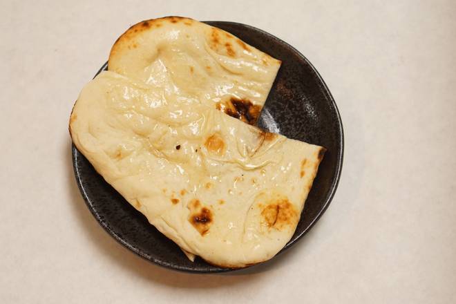 Order Naan (1 pc) food online from Wok Indian Kitchen store, Suwanee on bringmethat.com