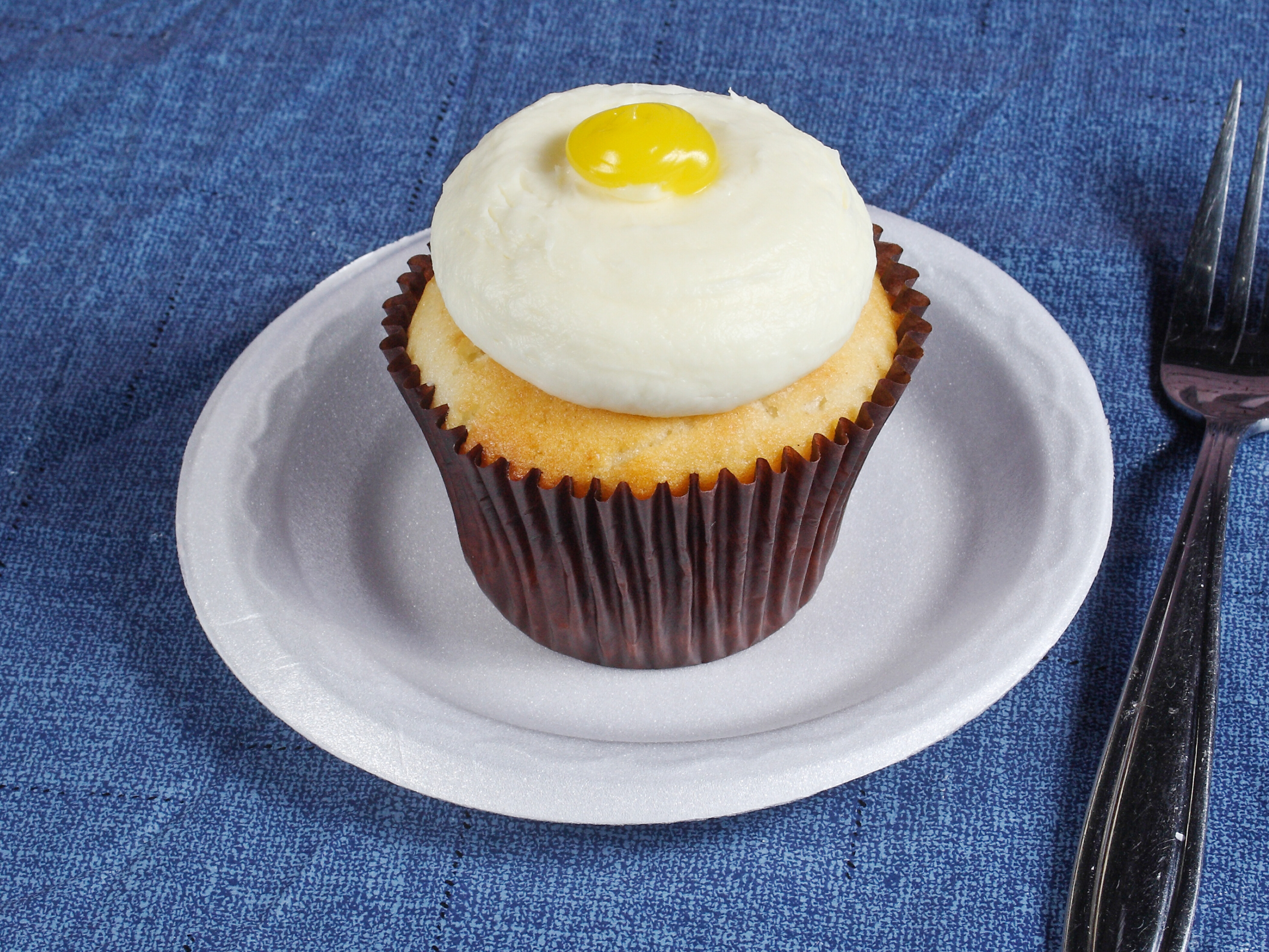 Order Lemon Drop Cupcake food online from Smallcakes store, Huntersville on bringmethat.com