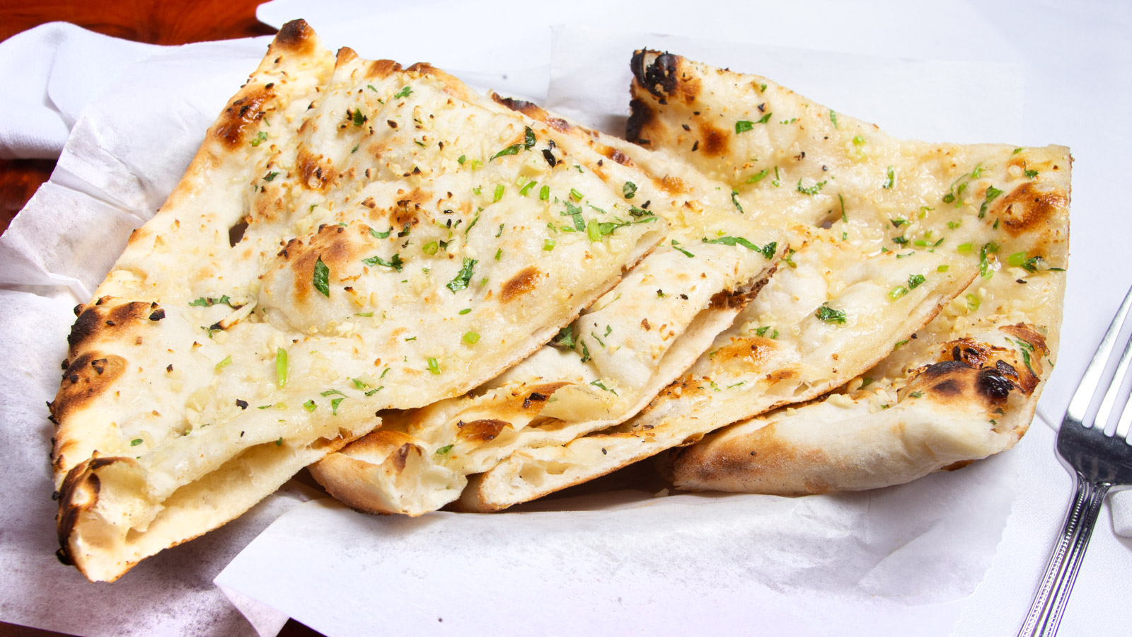 Order Garlic Naan(G) food online from Mirch Masala Cuisine Of India store, Groton on bringmethat.com