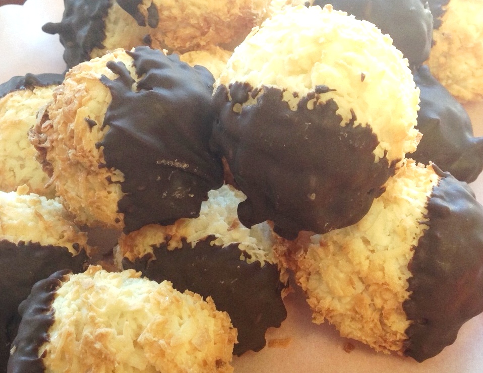 Order Coconut Macaroon dipped in Dark chocolate food online from The Village Bakery store, Houston on bringmethat.com