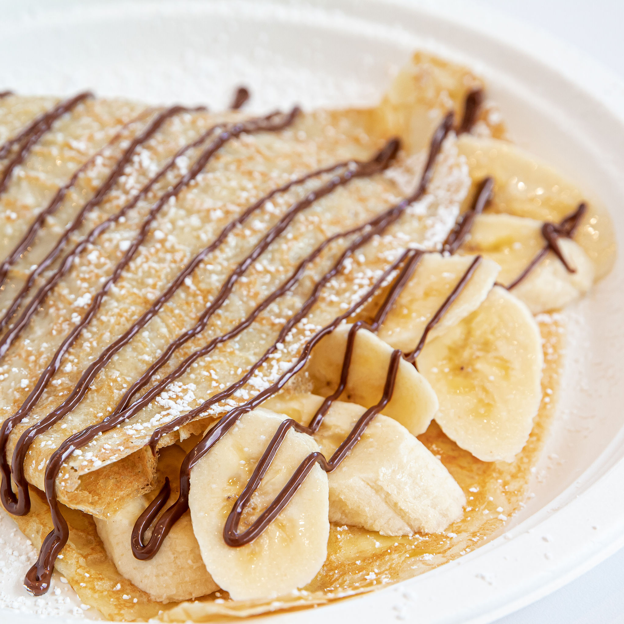 Order Nutella Banana Crepe food online from Hazelnuts Creperie store, Charlotte on bringmethat.com
