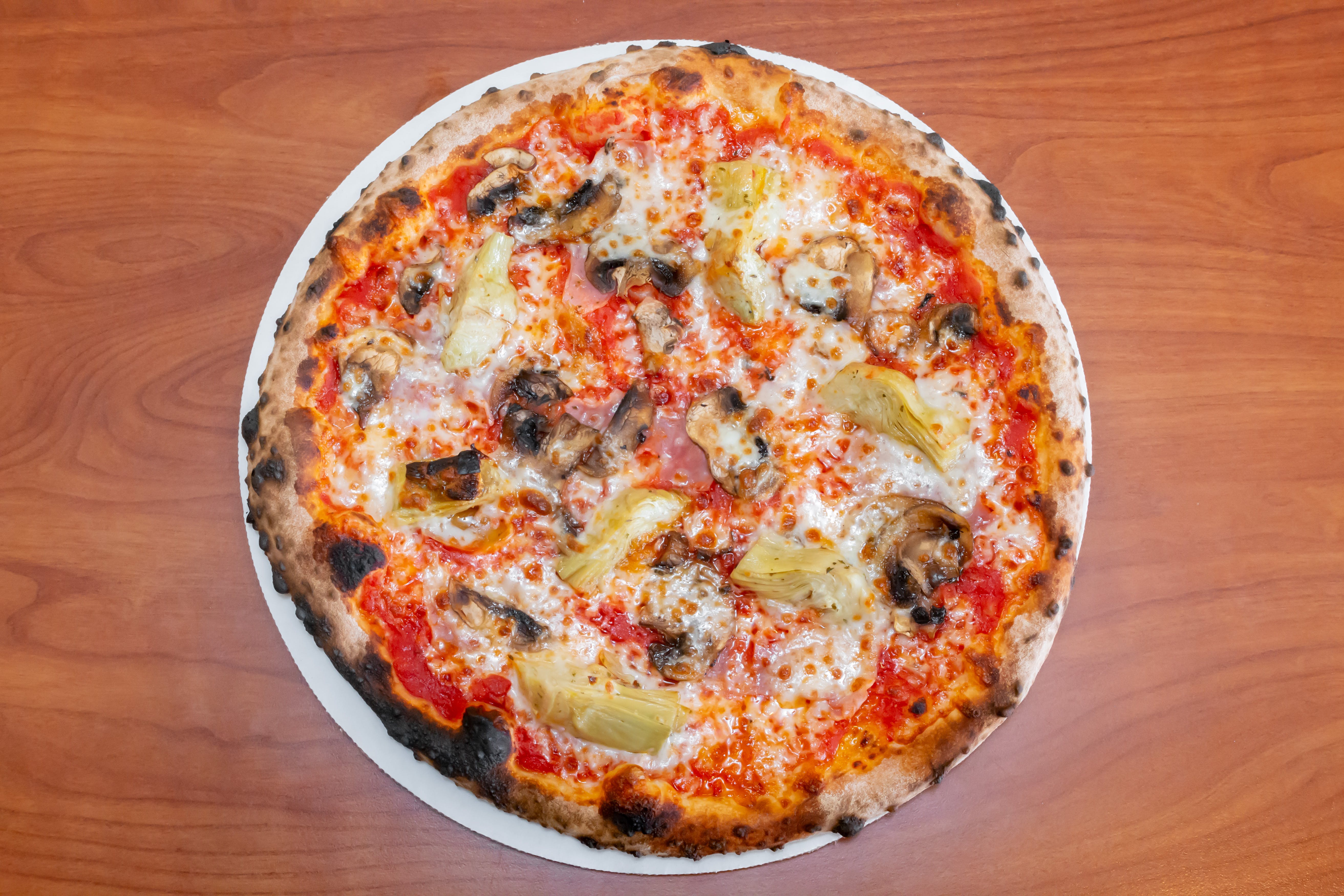 Order Capricciosa Pizza - Medium 12'' (8 Slices) food online from Serino's Italian Deli store, Addison on bringmethat.com