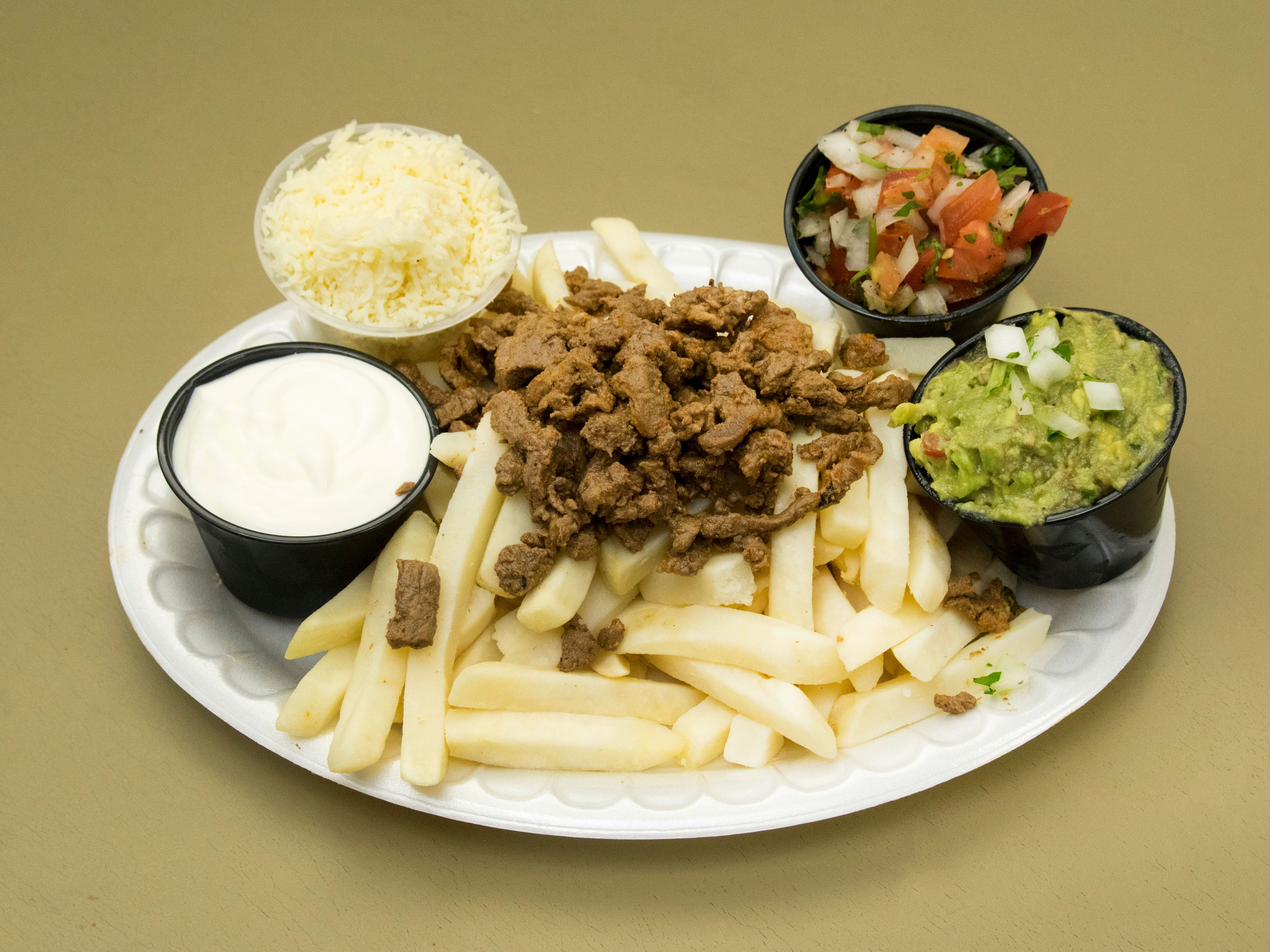 Order Carne Asada Fries food online from Liticker's Mexican Grill store, San Diego on bringmethat.com