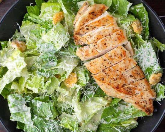 Order Caesar Salad with Crispy Chicken food online from East and Feast Lounge store, Austin on bringmethat.com