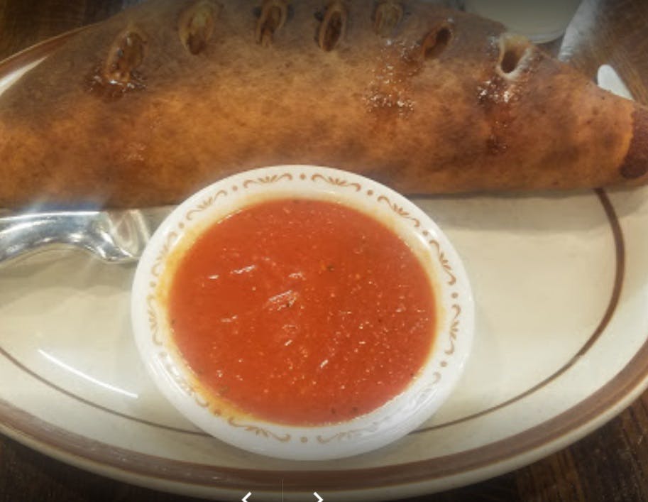 Order Traditional Calzone - Calzone food online from Delia's Pizzeria & Grill store, Springfield on bringmethat.com