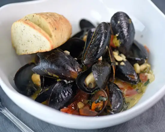 Order Steamed P.E.I Mussels food online from Grindstone Tap House store, Berea on bringmethat.com