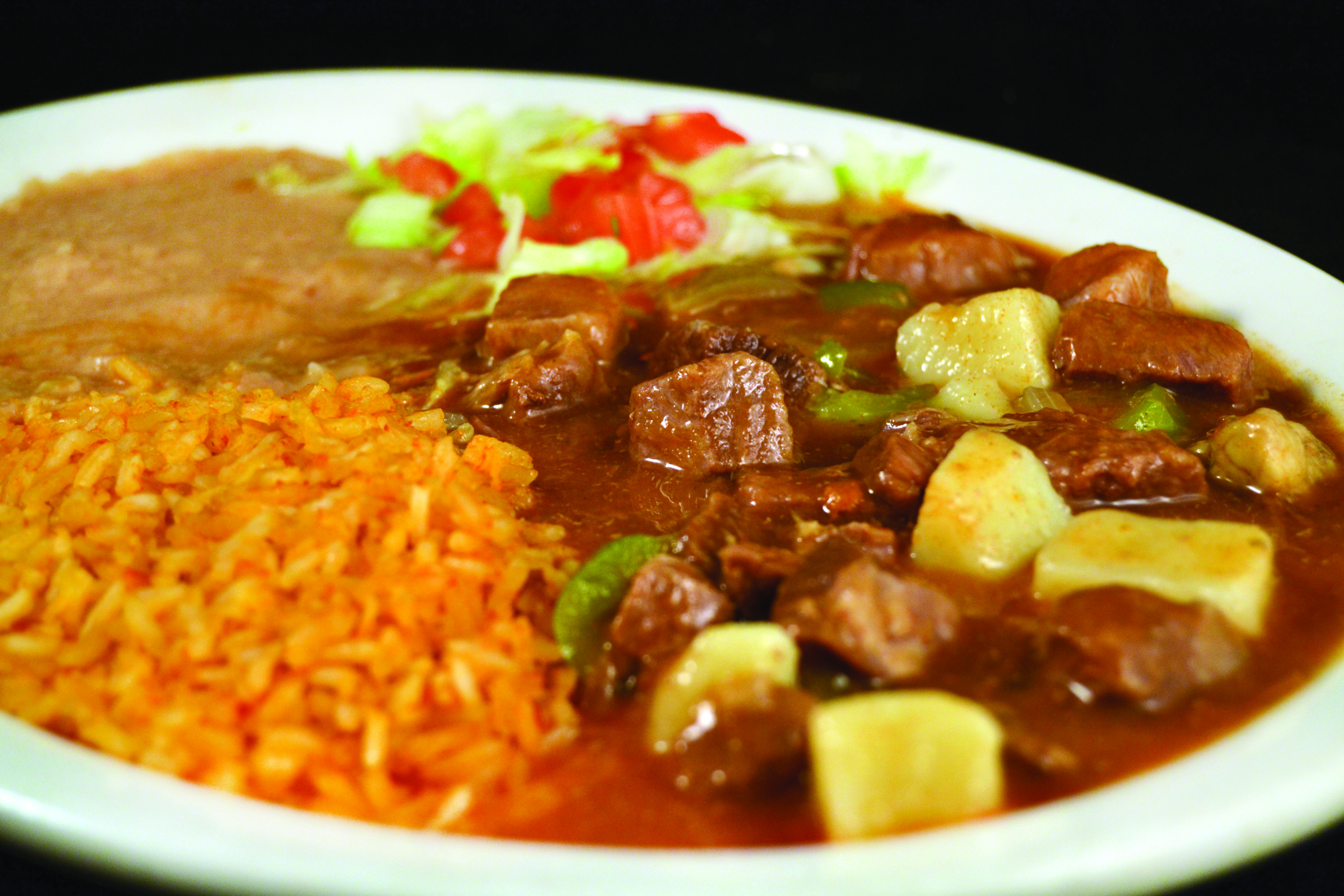 Order Carne Guisada food online from Mi Comal Mexican Restaurant store, Irving on bringmethat.com