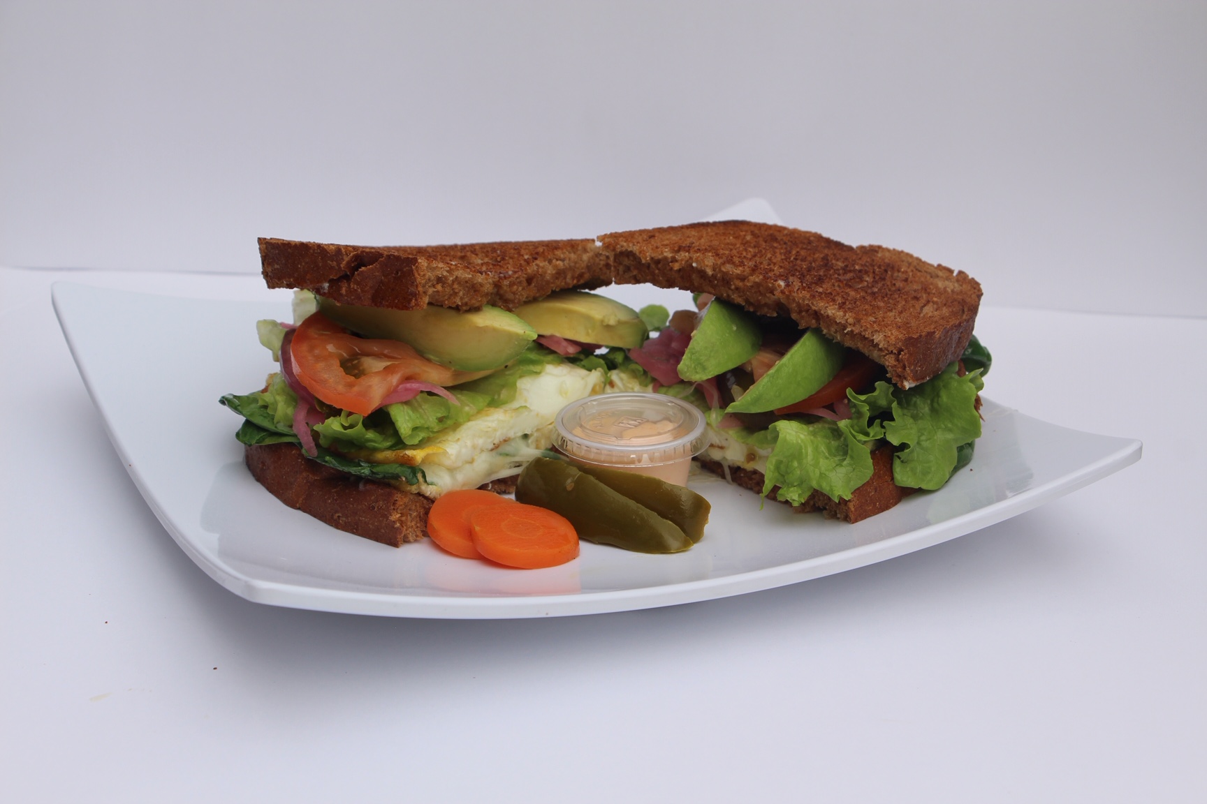 Order Egg and Spinach Sandwich food online from Pura Vida Cafe And Juice Bar store, Downey on bringmethat.com