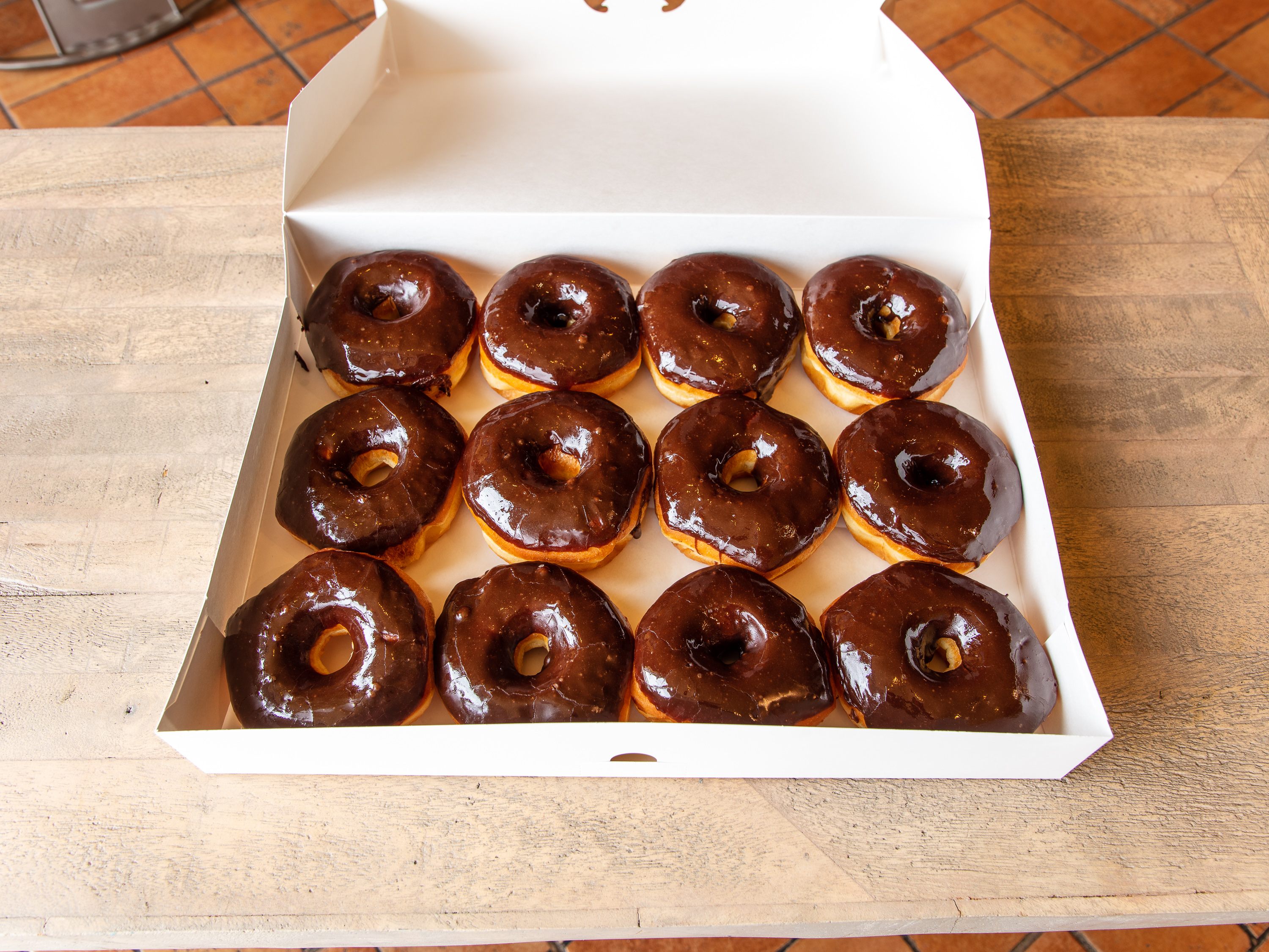 Order 1 Dozen Chocolate Glazed Donuts food online from Donna Donuts store, Keller on bringmethat.com