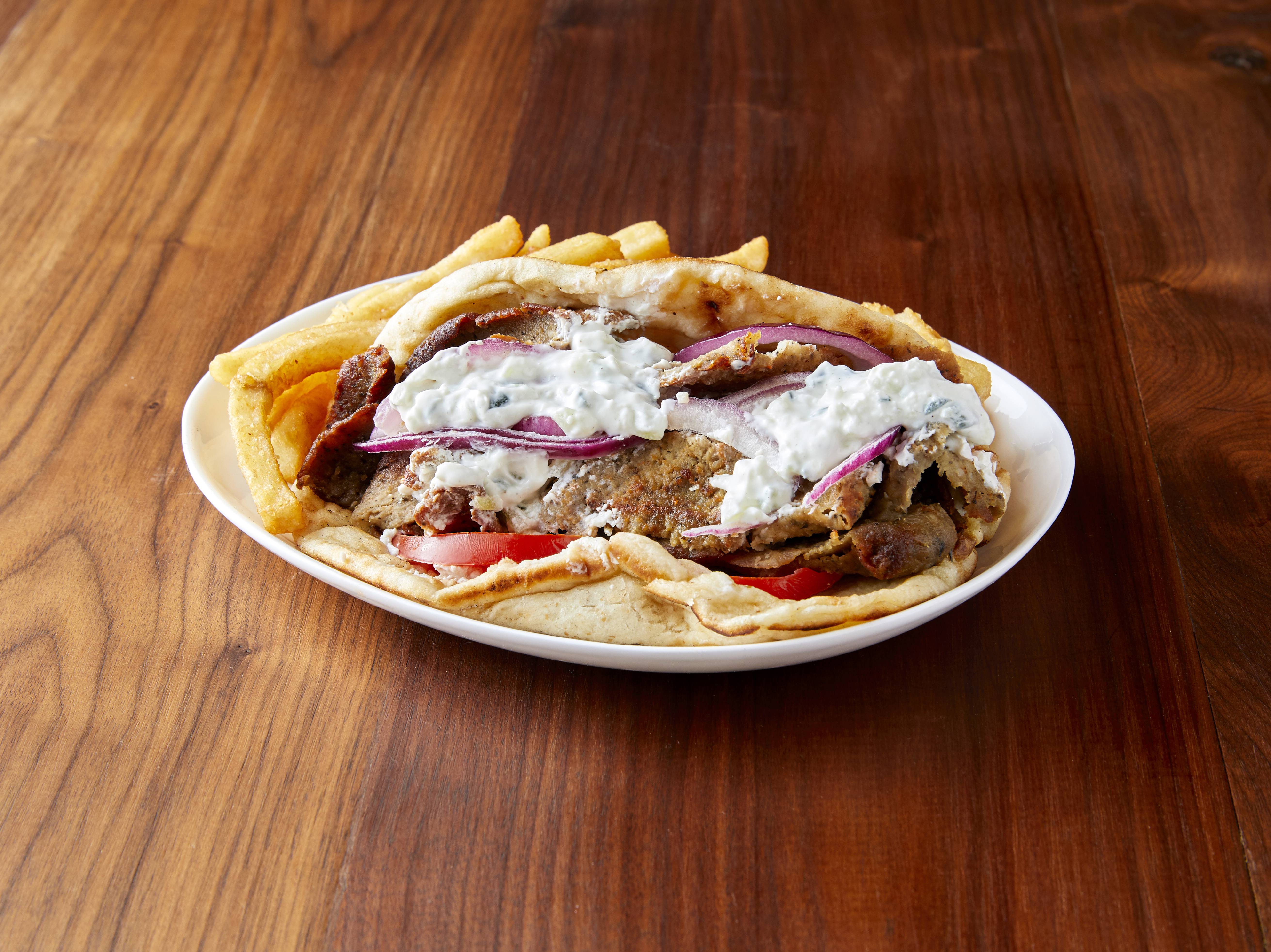 Order Gyro Sandwich with Fries food online from Lake's Best Pizzeria store, Chicago on bringmethat.com