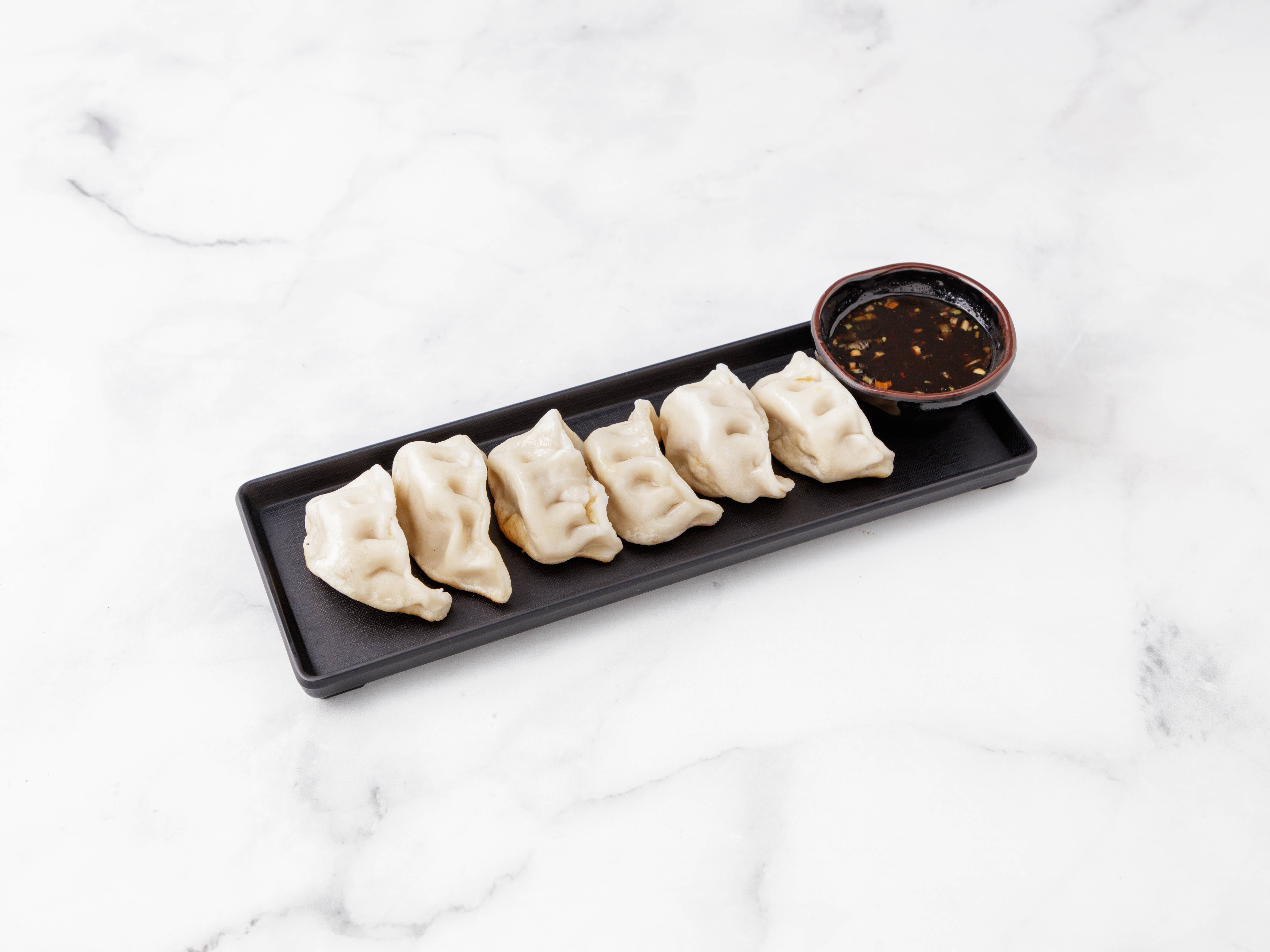 Order 7. Pork Dumpling food online from China King store, New Haven on bringmethat.com
