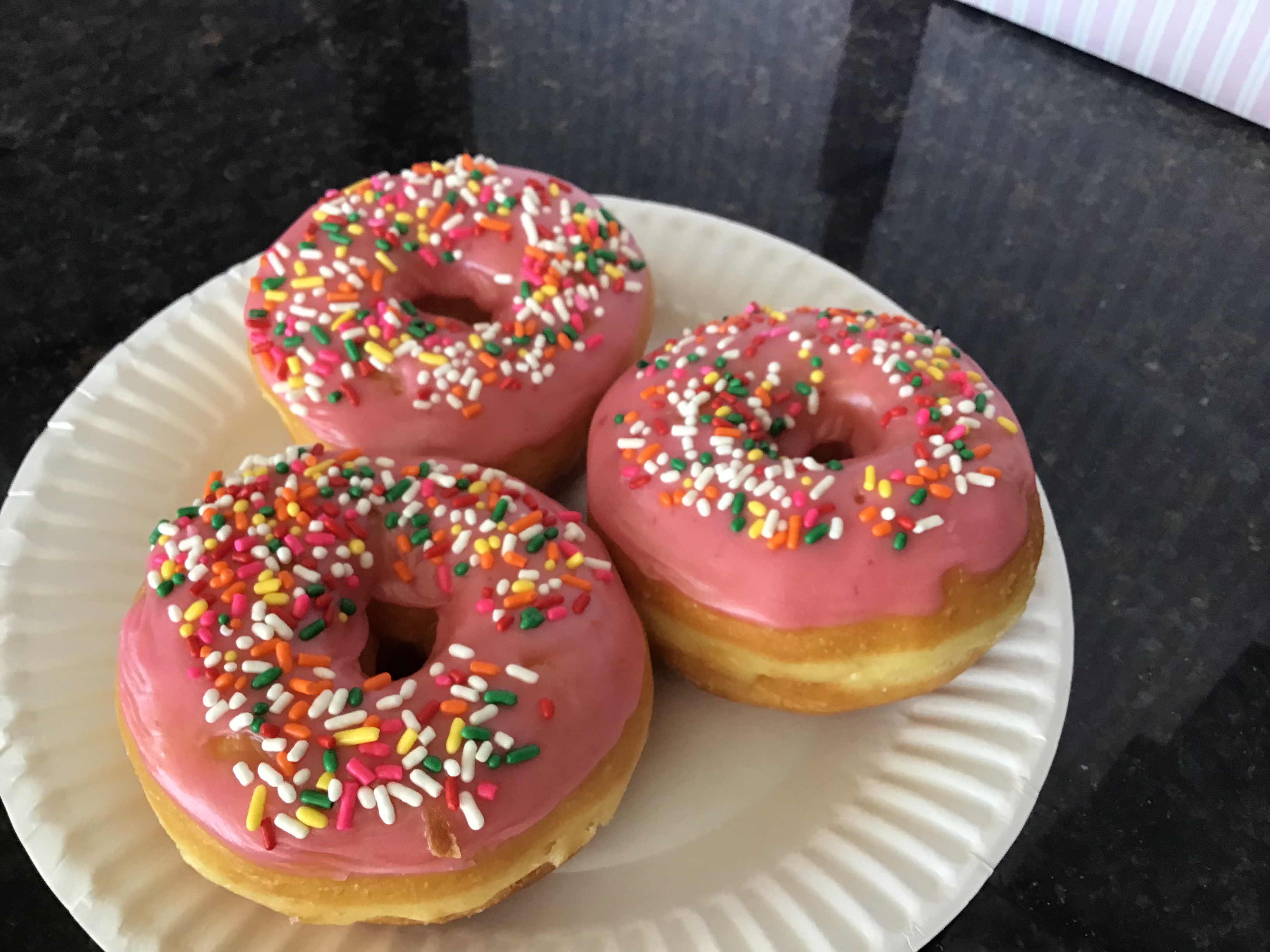 Order Raised Donut with Strawberry Sprinkle food online from Donut Basket store, Modesto on bringmethat.com
