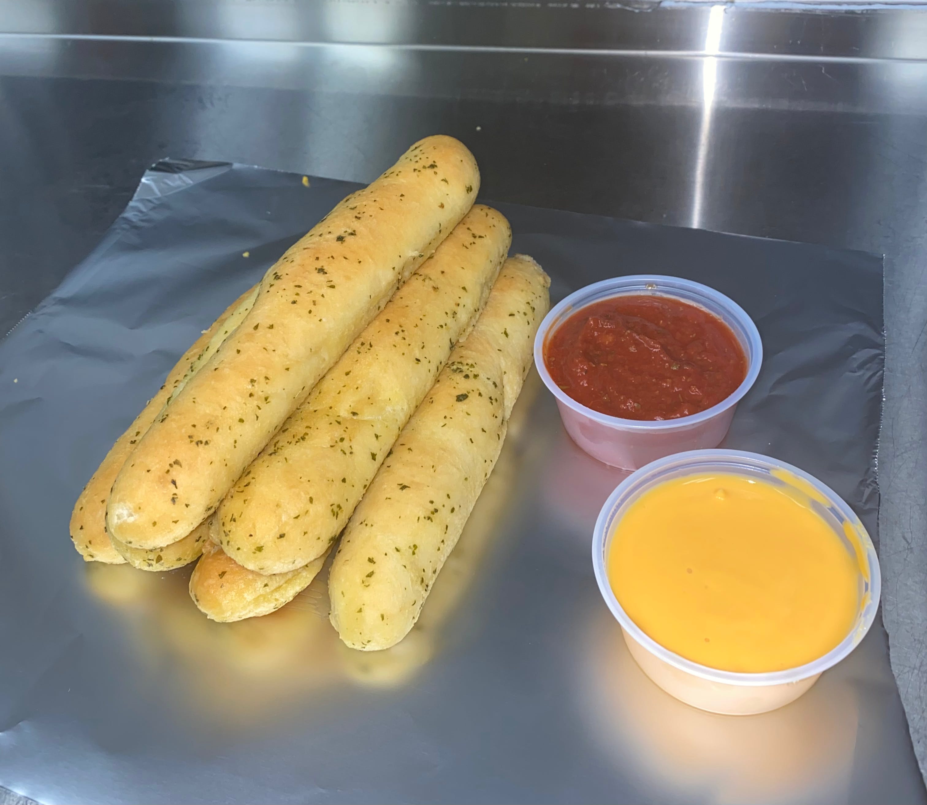 Order Parmesan Garlic Breadsticks - 1 Piece food online from Columbia City Pizza store, Columbia City on bringmethat.com