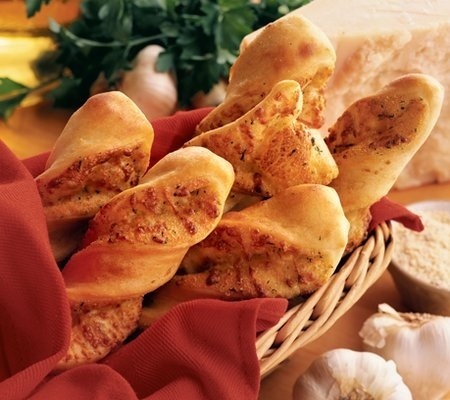 Order 6 - Garlic Parmesan Twists™ food online from Round Table Pizza store, Pacifica on bringmethat.com