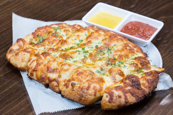 Order Cheesy Breadsticks food online from The Couch Tomato Cafe store, West Chester on bringmethat.com